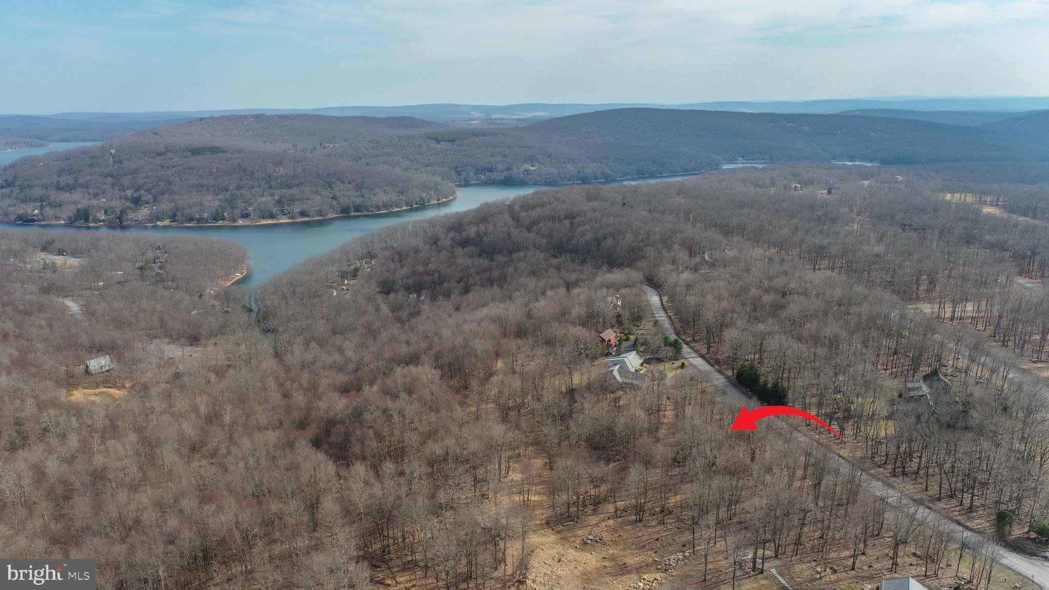 Prime 1.67-Acre Wooded Lot with Expansive Deep Creek Lake & Mountain Views! Discover the perfect blend of tranquility and adventure with this stunning 1.67-acre wooded building lot, offering breathtaking panoramic views of Deep Creek Lake and the surrounding mountains. Nestled along a county-maintained road for easy year-round access, this exceptional property provides the ideal setting for your dream home or vacation retreat. Located in the heart of Garrett County’s premier outdoor recreation area, this lot is just minutes from Lodestone Golf Course, ranked among the best mountain courses in the region, and Wisp Resort, offering four-season fun with skiing, snowboarding, mountain biking, and more. Enjoy the peace and privacy of your own wooded escape while being just a short drive from the lake’s marinas, state parks, and charming local shops and restaurants. Whether you're seeking a serene getaway or an investment in one of Deep Creek’s most sought-after locations, this property offers endless possibilities. Don't miss this rare opportunity to own a slice of paradise in the mountains of Western Maryland!