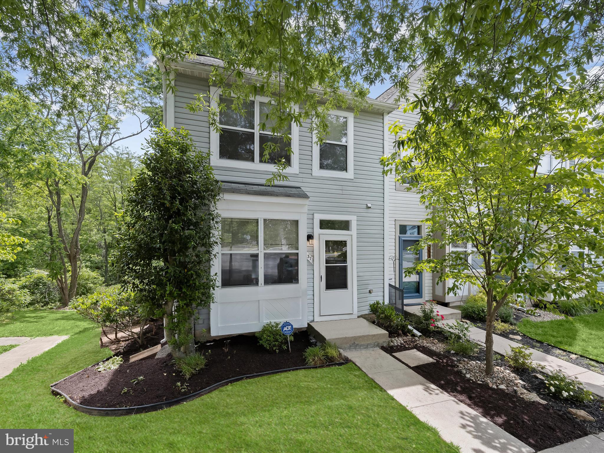 Discover this beautifully renovated end-unit townhouse offering three spacious levels of comfort, style, and convenience in a prime Columbia location. Step inside to find fresh neutral paint, new luxury vinyl plank flooring, new ceiling fans, upgraded light fixtures, and new carpeting in all bedrooms and the lower level, creating a warm, modern atmosphere throughout. The welcoming foyer opens to a light-filled kitchen featuring freshly painted gray cabinets, a charming bump-out with table space, a pantry, and updated finishes. The open-concept living and dining area is perfect for entertaining, with multiple windows and a sliding glass door that leads to the deck, ideal for enjoying quiet moments or hosting friends. Upstairs, the spacious primary bedroom boasts a vaulted ceiling, a double closet, and an en suite bath. Two additional bedrooms and a full bath complete the upper level. All bathrooms in the home have been updated with stylish new light fixtures and new faucets for a refreshed look and feel. The finished lower level includes a cozy family room with new carpet, another sliding glass door, and views of the trees beyond, adding to the home's peaceful setting. Additional upgrades include a recently replaced water heater and washer, providing added peace of mind and convenience. Enjoy nearby amenities like Kings Contrivance Village Center for shopping and dining, as well as outdoor recreation at Huntington Park and the Robinson Nature Center. Major commuter routes including Route 29, I-95, and Route 32 are just minutes away, offering easy access to Baltimore, Washington, D.C., and surrounding areas. Plus, The Mall in Columbia and the lively Merriweather District are close by, with an exciting mix of upscale restaurants, casual eateries, and entertainment options to explore. Please note: photos depicting furniture have utilized virtual staging.