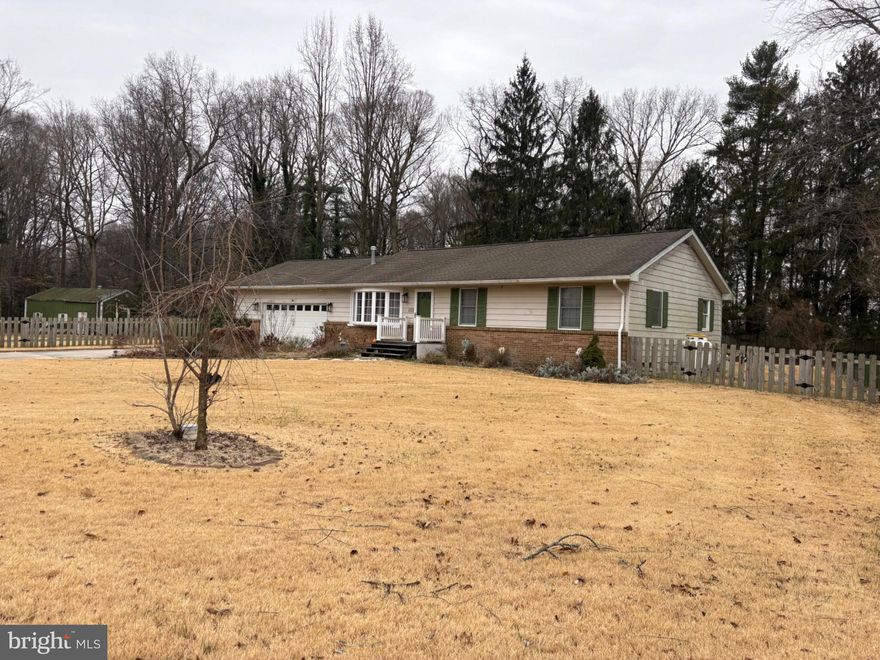 Welcome to this charming ranch-style home offering 3 bedrooms and 2 full bathrooms, perfectly situated on a spacious .9-acre lot in a desirable neighborhood with no HOA. This property backs to peaceful woods, providing privacy and a serene setting. Inside, you’ll find comfortable one-level living along with a full unfinished basement offering endless potential for additional living space or storage. The home features an attached garage, a bright sunroom ideal for relaxing year-round, and a pole barn with electric—perfect for hobbies, storage, or a workshop. A fully fenced yard completes this property, making it ideal for outdoor enjoyment, pets, or entertaining.