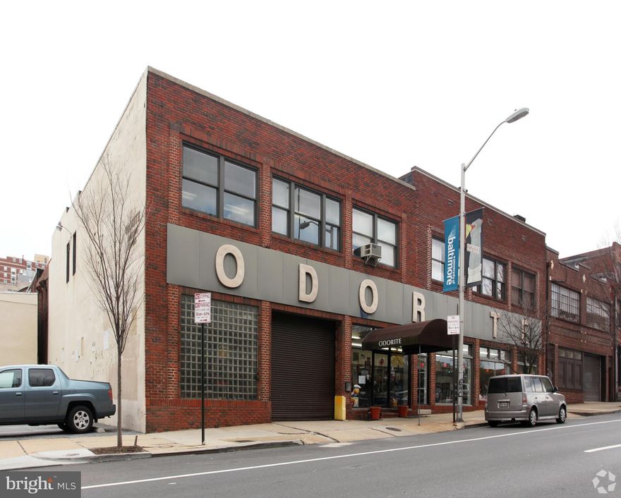 REAL ESTATE AUCTION featuring ON SITE and SIMULCAST ONLINE BIDDING!! Online Bidding Opens - Monday, December 8, 2025. Live On-Site Auction - Wednesday, December 10, 2025 at 2:00 PM. List price is opening bid only. Live Auction Bidders – A deposit of $100,000, payable by cashier’s check, will be required of the purchaser at time and place of sale. Online Auction Bidders – A deposit of $100,000, payable by cashier’s check or wire, will be required of all online bidders prior to the start of the live auction. The deposit will be held in escrow until the completion of the auction and will be retained from the winning bidder. The subject property comprises a flex showroom building with parking, loading dock and drive-in bays in the Midtown-Belvedere neighborhood in central Baltimore City immediately north of Mount Vernon. The site includes 5 lots totaling 0.40 acres with frontage on two streets and a 10′ alley. The building was home to the ODORITE Company, who called the Mount Vernon area home for approximately 70 years before being sold in 2023. The auction provides an opportunity to purchase a large, contiguous site with substantial building near the University of Baltimore, MICA, Penn Station and many of Baltimore’s most important arts and cultural centers. The site is well positioned as either a prominent business headquarters or for a comprehensive redevelopment for any number of commercial, residential or mixed uses.