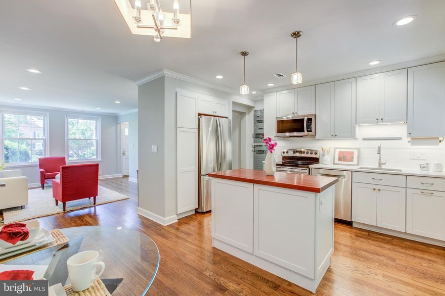 "FEELS LIKE NEW CONSTRUCTION THROUGHOUT" New Gourmet Open Kitchen w/ Island Configuration Everyone Wants In Fairlington. High-End White Shaker Cabinetry, Suite of High-Efficiency Stainless Steel Appliances. White Carrara Marble Counter w/Brazilian Cherry On The Island. Luxury Master Bath w/ High-End Materials and Finishes. Large Fully Finished Basement w/Back Den Used As a 3rd Bedroom Steps to Renovated En-Suite Full Bath. Entire Home Painted In Modern Move In Paint Colors. Stunning Living Room Recessed Lighting w/ Crown Molding Throughout. Gleaming Hardwoods. Elegant Attention To Detail Including Custom Banisters and High-Quality Custom Closet Systems Throughout. Energy-Efficient Windows and Highly Rated 2016 HVAC-Heat Pump. Pull Down Stairs to Floored Attic For Ample Storage. Large Private Brick and Fenced In Patio Oasis Leading to Picturesque Green Spaces. Rare Assigned Parking Space- #128. Pool, Tennis Courts and Tot Lots For Your Pleasure. The Incredible Green Spaces And Abundance Of Park Like Settings Are One Of The Reasons So Many People Are Drawn To This Incredible Community. There Are Four Major Shopping Areas All Within Walking Distance That Gives Residents The Ability To Walk Everywhere. Shirlington Village Offers Shops, Restaurants, Grocery Store, Library, Movie Theatre And Signature Theatre. The Community Has A Plethora Of Walking Trails, Dog Parks And An Unmatched Friendliness That Is Refreshing. We Hope To See You Soon Visiting This Wonderful Place To Live.