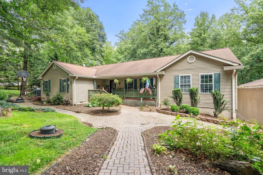 Tucked away in the scenic Shenandoah Farms Mountain Lake Division, this oversized rambler offers the perfect blend of privacy, space, and comfort on a wooded 1.2-acre lot. Whether you're looking for year-round living or a weekend getaway, this property delivers the ideal mountain retreat experience.
Boasting 3+ bedrooms, this home offers flexibility for growing households, guests, or remote work needs. The heart of the home is an oversized family room, perfect for gatherings, movie nights, or cozy evenings by the stone fireplace - each stone was handpicked from the Shenandoah River. The finished basement expands your living space even further, complete with a Sitting/Rec Room, Den, and Exercise Room—ideal for entertaining or relaxing.
Step outside and enjoy the beauty of nature from multiple decks, perfect for entertaining, grilling, or simply soaking in the peace and quiet of the surrounding trees. The wooded lot offers both beauty and privacy, making outdoor living a true pleasure.
A standout feature is the charming "She Shed" or potential Man Cave—an ideal creative space, workshop, or quiet getaway tailored to your lifestyle.
With community lake access and a tranquil setting just a short drive to Front Royal and the Shenandoah River, this property offers the serenity of rural living with modern conveniences nearby.