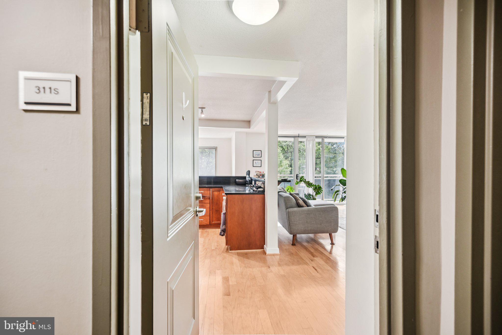 Welcome Home! As you step inside, you’re greeted by beautiful natural light streaming through the large dining room window and sliding glass doors that lead to your very own private balcony . The open floor plan means you can chat with guests while whipping up your signature dish… or artfully arranging your favorite takeout containers. Just down the hall, you’ll find the first bedroom — ideal for guests, a home office or whatever you choose to make it. Nearby is the first of two full bathrooms, because one just isn’t enough. The spacious primary suite is your personal retreat, complete with a walk-in closet. Plus, enjoy the convenience of your own ensuite bathroom. Hardwood floors run throughout the main living areas, while carpet keeps the bedrooms cozy and soft underfoot. Never worry about finding a parking spot on those late nights out because this unit comes with a spot just for you. Nearby you will find shopping and plenty for you to do. Schedule your showing today, your new home is waiting!