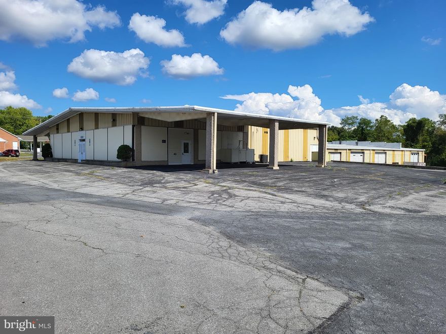 A 14,330 sq.ft. auto-service/flex building in the heart of the Route 340 corridor between Charlestown, WV and Frederick, MD.  Many commercial uses are permitted by-right to serve the local community & surrounding areas.

Sales Price:  $1,600,000 As-Is (tools, equipment, furniture, storage container, etc. do not convey). 

Building:  Formerly the Virginia Coach bus depot, the building is 14,330 sq.ft. (a 5,840 sq.ft.   office/showroom and an 8,490 sq.ft. service building with 4 drive-thru bays and 1 smaller drive-in bay; there are also 3,150 sq.ft. below grade in addition to the 14,330 sq.ft.).  Built in 1973, the building has a concrete slab, steel-frame construction with metal siding & roof.  The service bays have a clear height of 18’ with 14’ overhead doors.  The building is situated on 2.523 acres of land.

Zoning:
