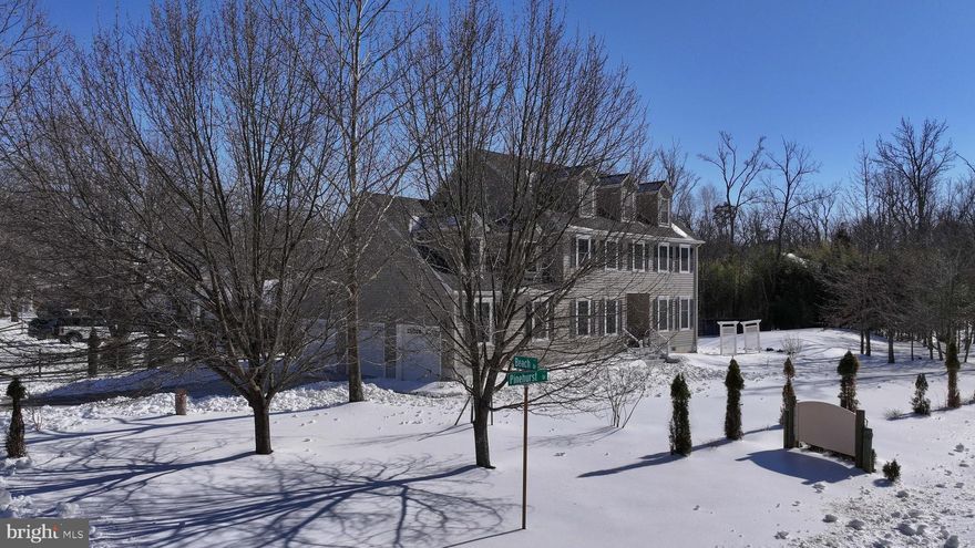 **VA Assumable loan for qualified buyers at 3%**  Discover the perfect blend of elegance and comfort in this stunning Colonial home nestled in the desirable Pinehurst subdivision. Spanning over 4000 sq. ft., this residence boasts an open floor plan with beautiful hardwood floors throughout the main level. The beautifully designed kitchen is perfect for both everyday cooking and effortless entertaining.  With GE stainless steel appliances and an open layout that keeps the cook connected to guests, it’s a natural gathering place where meals, conversations, and celebrations come together.  Open to the kitchen is a generously sized family room with a gas fireplace, for conveniently enjoying warm evenings by the fire.  Atrium doors from the family room lead to a professionally constructed composite deck with vinyl railings overlooking a paver patio and the well-cared-for lawn and landscaping.  Retreat to the spacious primary suite featuring a private en-suite bathroom with a dual-head walk-in shower and walk-in closet.  The upper level offers 4 or 5 bedrooms.  The 5th is a large bonus room over the garage and currently serves as a second family room.  Flexible, finished 3rd level space could serve as an office, guest space or media room.  Enjoy the convenience of a three-car garage and a concrete driveway, providing plenty of parking for guests. Just blocks away from Bodkin Creek and the Chesapeake Bay, the voluntary community association offers a bayfront beach and a boat ramp.  Indulge in water activities like boating, kayaking, fishing, or simply soaking in the serene views.  There is just one lot between this home and pedestrian access to one of Anne Arundel County's loveliest waterfront parks, Downs Park, which is 236 acres and has over 5 miles of paved and natural trails for walking, running and biking, a fishing pier, playground, beaches and more!  This home is not just a place to live; it's a lifestyle waiting to be embraced. Don't miss your chance to make this exquisite property your own!