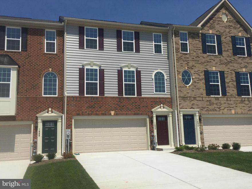 Great opportunity to own this early delivery brick front townhome including a 2 car garage, 4 ft extension on all 3 levels and 28 ft driveway. Features custom granite island, hardwood floors & large 5ft shower in owner's bath. Sought-after Greenway Farm community boasts walking trails, tennis court, outdoor pool and clubhouse. Images are representative only. AGENTS WELCOME!