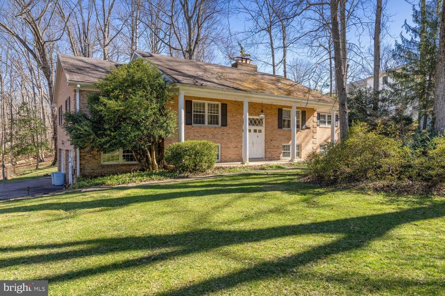 Location, Location, Location + a beautiful one acre flat/quiet lot for your enjoyment! This beautiful 4 bedroom, 3 bathroom home boasts an array of desirable features that are sure to impress. As you enter this full brick house, you will be greeted by graciously sized rooms and hardwood floors that create a warm and inviting atmosphere. The upper level offers a large open kitchen, ideal for entertaining & family gatherings. It features plenty of cabinet space, gas stove, updated appliances plus an island for extra counter space. The family room is open to the kitchen, featuring a wood burning fireplace, perfect for relaxing with your loved ones. The large dining room is adjacent to living room with a fireplace offering access to a large flagstone patio with an inground jacuzzi ,overlooking a quiet large/green backyard to enjoy family time + dinner under the stars. There are three bedrooms (including the primary bedroom) and two full bathrooms located on the upper level. Lower level offers a fourth bedroom + a full bath, a large cozy recreational room offering a bar and a wood burning fireplace plus a wood panelled library/office, making this house perfect for working from home. Additionally, lower level offers a laundry and access to a large two car garage offering plenty of shelved storage space.  The location of this home is unbeatable, with close proximity to Tysons Corner, Beltway, airports, and downtown DC.  Excellent access to transportation routes such as I-495, I-66, Rt. 7, Rt. 267 (Dulles Toll/Access Rd), Rt. 123, and the Metro Silver Line makes commuting a breeze. Nearby shopping options include Tysons Corner Center, Tysons Galleria, Wegmans, and countless restaurants. POOL COMES [AS-IS] BASIS.