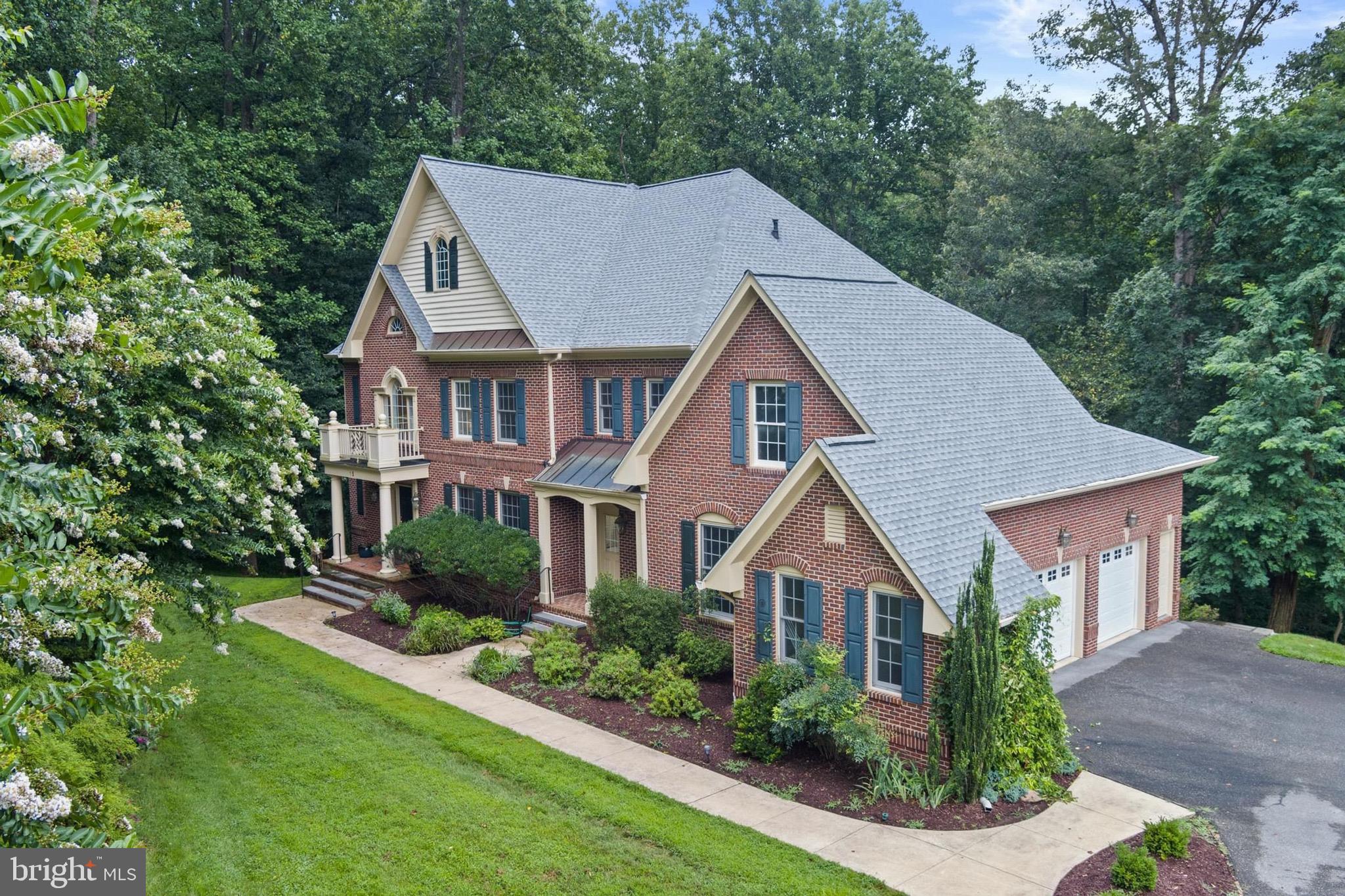 Welcome home! This stunning home boasts 4 spacious bedrooms, 2 dens, 4 full baths, 2 half baths, 3-car garage, finished basement, and so much more. Get ready to host lively gatherings in your gourmet chef's kitchen, two living areas, and a banquet sized dining room. This exquisite home welcomes you inside with an incredible two story entry foyer with circular oak stairs and hardwood floors throughout. The chef’s kitchen is a culinary masterpiece, featuring an oversized island, two dishwashers, brand-new refrigerator, and double ovens; perfect for hosting dinner parties. A main-level den flooded with sunlight adapts easily to an office, playroom, quiet retreat, or can be easily converted into a spare bedroom. A mudroom entrance and two 1/2 bathrooms rooms on the main level enhance daily functionality. The thoughtful layout includes dual staircases for added flow and privacy upstairs where you'll find an owner's oasis in the primary suite; offering a private sitting room, dual walk-in closets, and a luxurious en-suite bathroom. Two additional bedrooms share a well-appointed Jack & Jill bath, and a third bedroom serves as a separate guest suite that offers its own bathroom, walk-in closet, and cozy sitting area. The spacious finished walk-out basement offers a custom built wine-cellar, additional storage, full bathroom, and a den that can also be easily converted into an additional bedroom. Nestled at the end of a private driveway and backed by trees, this tranquil property offers exceptional privacy and serenity yet remains minutes from major commuter routes, Metro access, shopping, and dining. With no HOA and refined yet timeless craftsmanship throughout, this rare gem invites you to experience elevated living. Recently replaced HVAC and roof offers additional peace of mind. Schedule your private tour today.
An additional neighboring vacant lot is available for purchase separately to the buyer of this home. Please inquire.