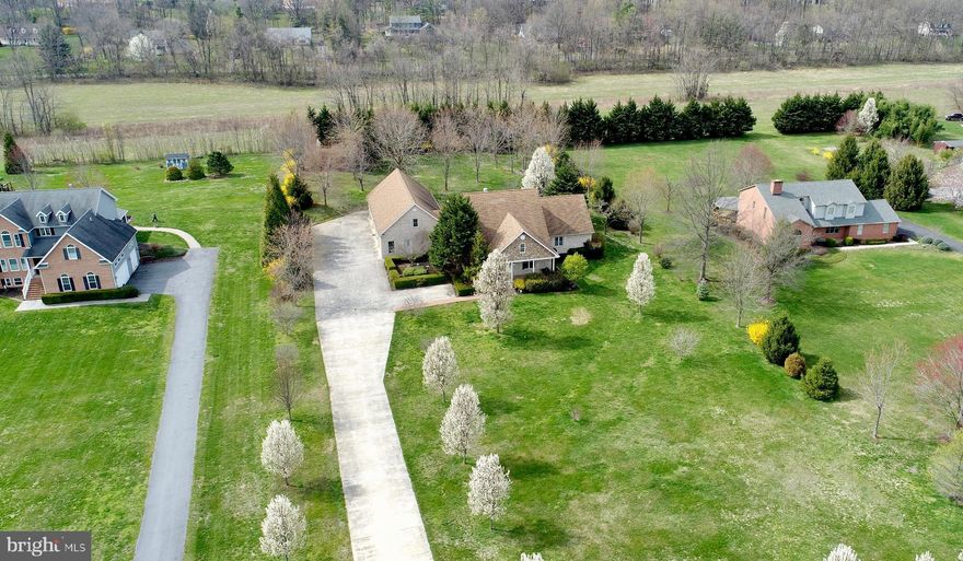 Stunning Custom  4 Sided Brick Home resting on just over 1.5 acres boasting 3800+ sq ft of Living space and an additional 3100 sq ft of unfinished living space ready for you to finish! Entering through the 2 story Foyer, the main level of this home is truly a dream. Large Family Room w/gas fireplace, Formal adjoining Dining Room, Gourmet Kitchen - Corian Countertops, Cherry cabinetry, butler's pantry, stainless appliances, island, tile flooring, commercial gas 6 burner stove, &  built in wall oven. Main Level Master Suite complete with private luxury bath featuring a fireplace, huge walk-in closet, and adjoining private enclosed flagstone porch! The expansive Sunroom features a 3 sided fireplace and ceiling fans with tons of natural light! Upper level houses 3 additional large bedrooms and full bath with an extra 400 sq ft of unfinished space! Lower Level is framed in and has a full finished bath. Outside you will find many places to enjoy the views including a front porch and rear brick patio. 6 car 30x60 attached oversized garage with storage area. Close to commuter routes, shopping, and hospital, this one of a kind well cared for one owner property is a MUST SEE!
