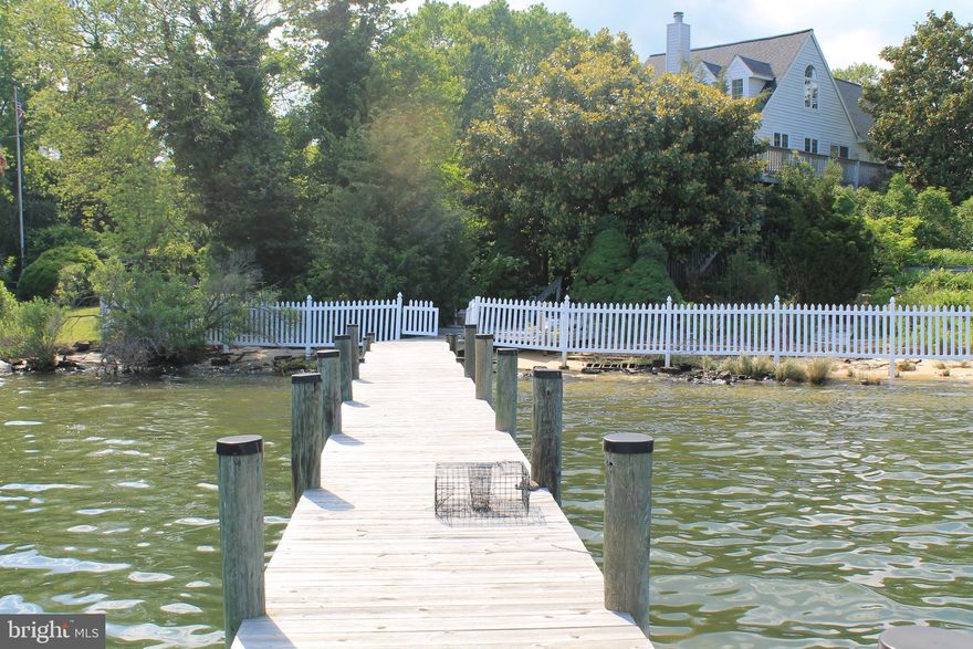 Includes additional LOT next door  229 Point Lane!! Unbeatable views of Back Creek and Solomons Harbour. Such an amazing location. With the right TLC this house could be on in a million. High ceilings and open floorplan showcase the spectacular views. Don't miss your chance on this one.