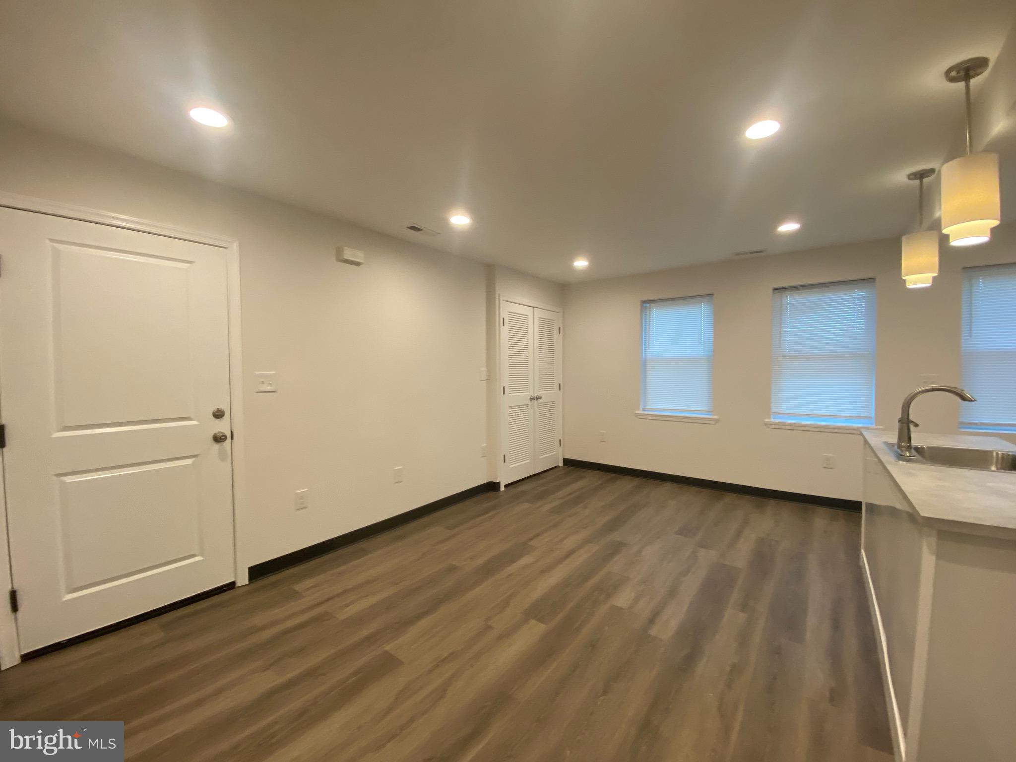 Spacious two-level renovated apartment (main level and basement) with 3 beds/2 bath plus den. In unit full size washer/dryer. Lead free.