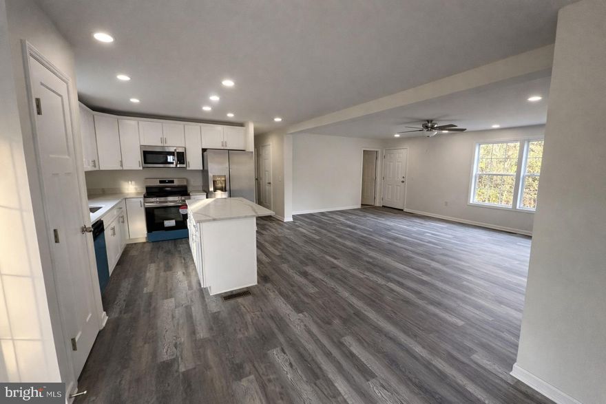 **PRICE DROP** New Construction home in a semi-rural setting, surrounded by trees and nature.  Beautiful construction Raised Ranch style two-level home with a 2-car drive-in garage and modern open kitchen.  The Kitchen has beautiful Frigidaire stainless appliances and quartz countertops.  The home includes high quality energy-efficient doors and windows and LVP flooring throughout with cozy carpet in the bedrooms.  Bedrooms have ample closet space, and the main bedroom has dual walk-in closets. This house has an unfinished, insulated attic ( about 1000sf usable space) with permanent walk-up stairs that is ready to be finished for a bedroom, office, or playroom. The unfinished basement has ground-level windows in the front, full rough plumbing for a bathroom, and is fully insulated for comfort.  Platinum home warranty included.