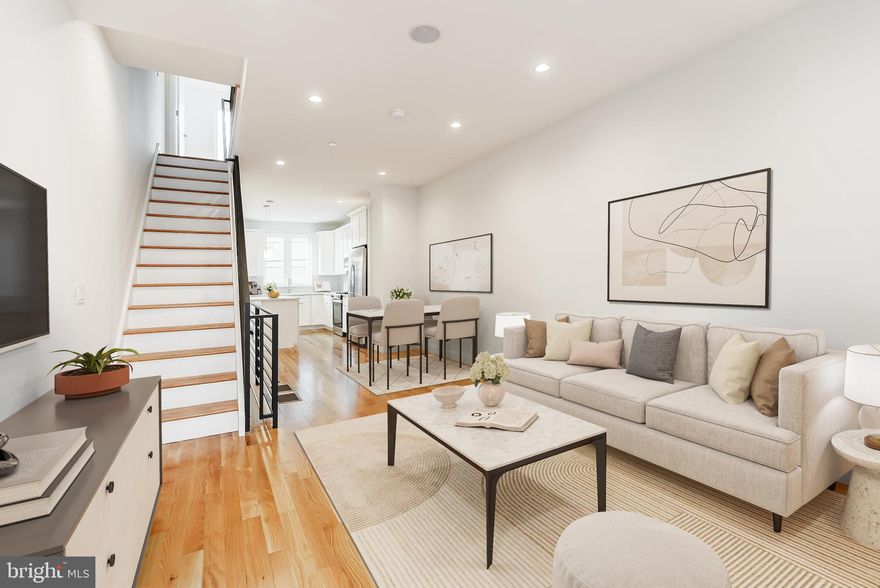 Welcome to 1432 S Taylor St, where modern design meets refined luxury. This newly constructed home built by a premier boutique builder showcases meticulous attention to detail and thoughtful craftsmanship throughout. An APPROVED TAX ABATEMENT adds long-term value.
This 3-bedroom + den,  3- full bath home with a completely finished lower level and roof deck, has a striking brick façade, oversized windows, and high ceilings that enhance the visual appeal and ensure an abundance of natural light throughout the interior.
Upon entering, you'll be welcomed by a spacious open floor plan. The living and dining rooms feature large windows, soaring ceilings, and elegant solid Oak Armstrong hardwood floors, creating an inviting atmosphere perfect for entertaining.
The eat-in kitchen is a chef's dream, featuring 42-inch self-close cabinets, quartz countertops, a designer backsplash, a GE stainless steel appliance package, and an expansive quartz center island with cabinetry and designer lighting. A rear door leads to a sizable patio with new fencing, ideal for dining al fresco.
The second level offers two spacious bedrooms with high ceilings, hardwood floors, and ample closet space. The guest spa bath features double sinks, designer tiles, and elegant lighting. A conveniently located laundry room completes this level.
The private master suite on the next level is a true retreat. The bedroom is flooded with light from floor-to-ceiling windows and offers a wall of deep closets. The luxurious master bath includes a 60-inch quartz vanity with double sinks, porcelain tiles, and a frameless glass walk-in shower. Adjacent to the master suite is a hall area with a 70-inch buffet station, quartz countertops, and a stainless-steel beverage refrigerator, providing direct access to the expansive roof deck.
The expansive roof deck is a highlight, offering breathtaking 360-degree views, including the entire Center-City skyline. Equipped with electricity, water, and under-mount lighting, it's perfect for entertaining or simply enjoying the view.
The completely finished lower level offers versatile space that can be used as a fourth bedroom, in-law suite, media room, home office, or fitness/yoga room. It features wide plank flooring, ample storage, and an additional spa bath with a frameless glass shower.
Additional features include recessed LED lighting, built-in speakers, 200 Amp electrical service, 2-zone HVAC, and a large Pex manifold.
Don't miss the opportunity to experience this stunning, visually pleasing home at 1432 S Taylor St. It's easy to show and guaranteed to impress. Schedule your appointment today and discover where luxury meets functionality.