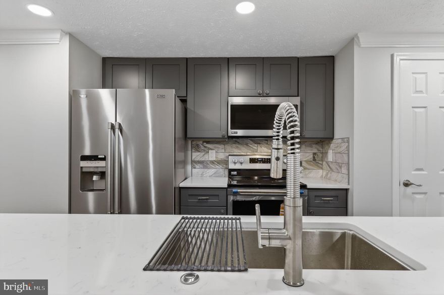 ***COMPLETELY RENOVATED*** and move-in ready, this beautifully updated 2-bedroom, 2-bath condo offers  stylish finishes and modern upgrades in the desirable Seneca Knolls Community Association. The brand-new kitchen features all-new luxury vinyl plank (LVP) flooring, quartz countertops, tile backsplash, soft-close cabinetry, crown molding, recessed lighting, pantry, disposal, and stainless-steel appliances. Both bedrooms also include new LVP flooring, ceiling fans, recessed lighting, and large windows, while the two fully renovated bathrooms feature porcelain tile surrounds, ceramic tile floors, and modern fixtures, including one with a bidet-ready toilet. Additional updates include brand-new windows, doors, hardware, switches, and outlets throughout. Enjoy everyday convenience with an in-unit washer and dryer, linen closet, walk-in closet, private patio, and an HVAC system only four years old. The low $325 monthly condo fee includes water, trash, snow removal, and common area maintenance. The home also includes assigned parking space #44 plus visitor parking. Ideally located within walking distance to Giant Supermarket in Meadowbrook Square and the Germantown Library is close by also. RIO Lakefront, Downtown Crown, and Kentlands Market Square, as well as Seneca Creek State Park only 15 minutes away. Commuters benefit from easy access to I-270, Route 355, Great Seneca Highway, Shady Grove Metro, and the Gaithersburg MARC station for convenient travel to Rockville, Bethesda, and Washington, DC.