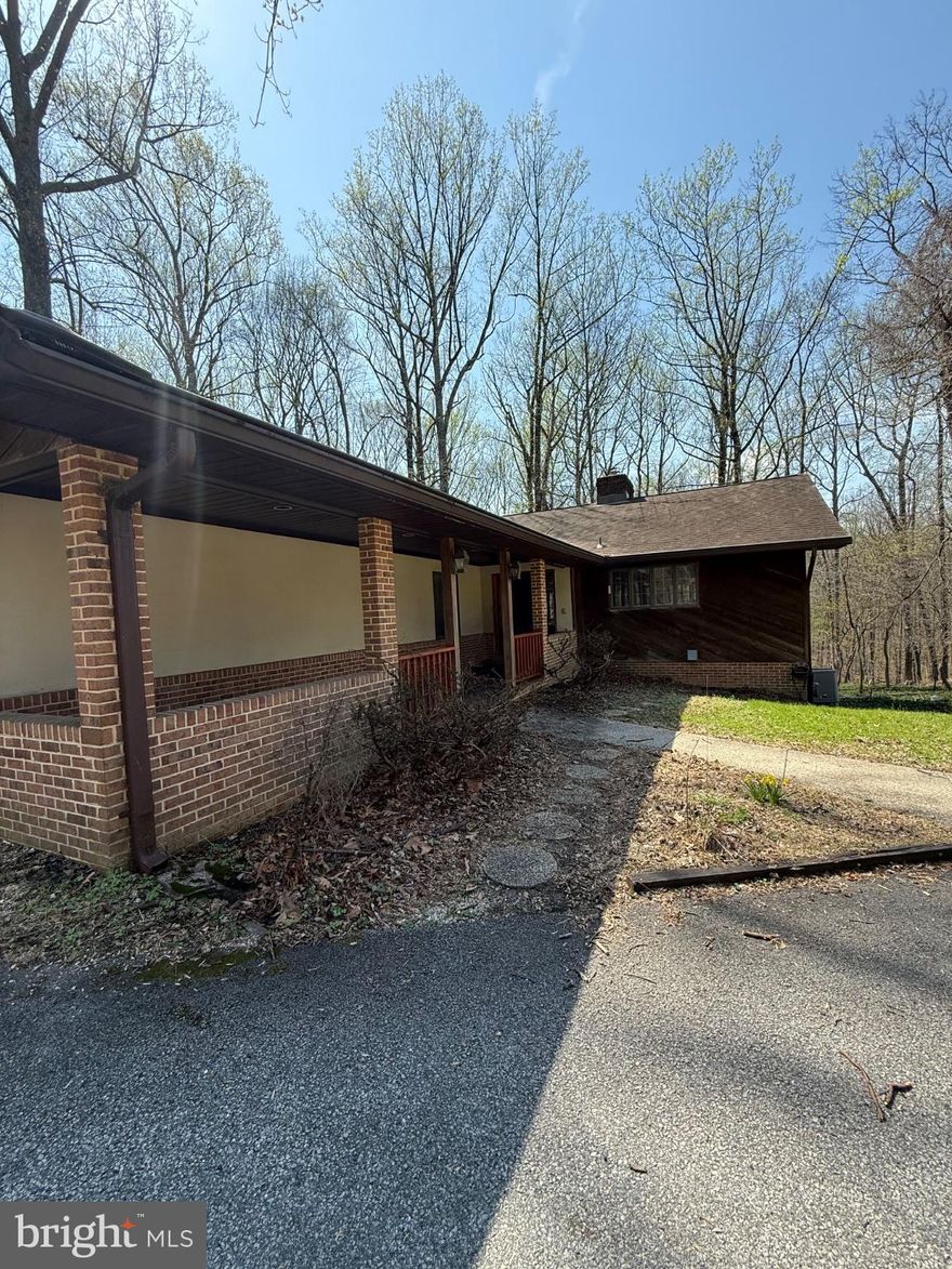 Seller is motivated to sell asap! Please send over any offer we are reviewing all!

Welcome to the sought-after community of Sagamore Forest! Offering over 2,800 finished square feet, this spacious home is move-in ready while also providing the perfect opportunity to add your personal touch. The main level features an inviting layout with hardwood floors in the living room and comfortable carpeting throughout the bedrooms. The large, open eat-in kitchen flows seamlessly into the screened-in porch, creating a wonderful space for everyday living and entertaining. This home also features skylights throughout the upstairs living and kitchen areas bringing in lots of natural sunlight.
The lower level expands your living options with a bedroom, a full bath, and a generous recreation room with walkout access. The converted garage is currently set up as a gym, offering a flexible space that can continue to be used for workouts, storage, hobbies, or reimagined to suit your needs. A radon mitigation system has also been installed for added peace of mind.

Outdoor living is a highlight of this property, with a two-level deck overlooking a beautiful wooded backdrop—an ideal setting for morning coffee, evening relaxation, or hosting guests. This home offers privacy, space, and the charm of a well-established neighborhood, all ready for its next chapter.