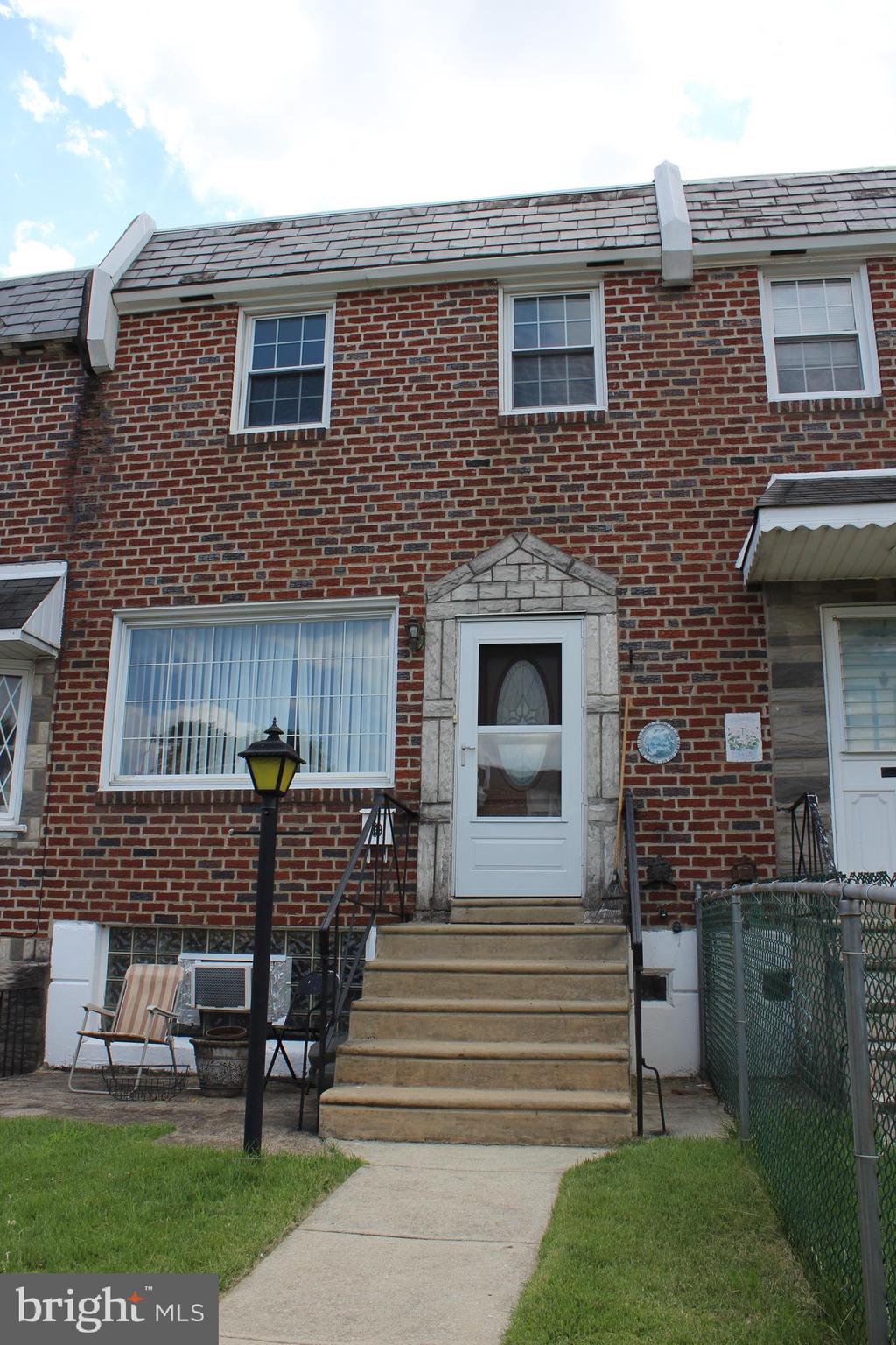 3 Bed, 1 Bath Brick Townhome in the Holmesburg neighborhood of Northeast Philadelphia. First Floor offers living rm, dining rm, and kitchen. Second Floor offers 3 Bedrooms and a Full Bathroom w/ skylight. Partially finished Walk Out basement with laundry. Back alley leading to an attached one car garage. Some of the features of this home include: new electric panel (2025), new gas hot water heater (2025), 5-year old front door, front patio, fenced in front yard. Walking distance to Camp Happy Park (Trumbette Playground), shopping, and restaurants.
