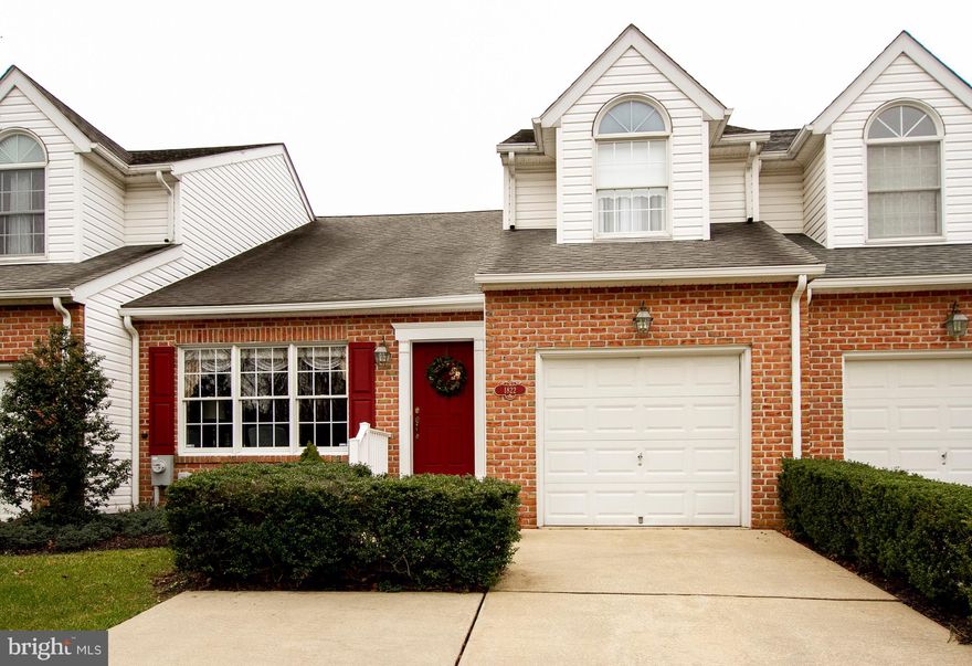 Beautiful Barrington! Immaculately maintained interior unit with all the highly requested Clark Turner touches. Prime location at the end of a cul-de-sac with trees and open space in rear. Handsome hardwood floor throughout main level, tray/vaulted/cathedral ceilings, moldings, bump outs on main and lower level. Main level conveniences include: master bedroom with private bath and walk in closet, laundry center, spacious family room adjoins kitchen, formal living and dining rooms. Upper level loft with walk in storage area, full bath, second bedroom and possible third bedroom/office. Full lower level with walk out. Attached garage. Ample guest parking. Loads of space - bring everything!