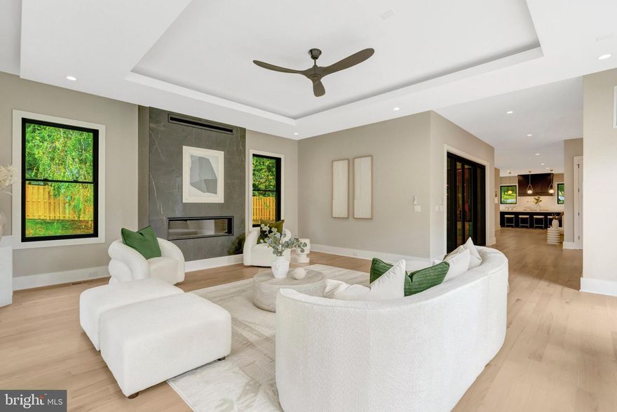 Step into this extraordinary prairie-style residence—where modern elegance, timeless architecture, and thoughtful design meet—nestled in one of McLean’s most coveted neighborhoods.Offering over 7,450 square feet of beautifully finished living space, a BUILT-IN DUMBWAITER TO TRANSPORT YOUR GROCERIES, and a PRE-FRAMED ELEVATOR SHAFT for future installation,  this home features 6 spacious bedrooms, 6 full spa-inspired bathrooms, 2 stylish powder rooms, and a 3-car garage. EV-ready and meticulously crafted, it’s a showcase of sophistication and functionality. Premium Pella Lifestyle black windows and a sunlit walk-up basement further elevate its appeal.A grand two-story foyer welcomes you inside, where soaring ceilings and natural light highlight the rich solid oak hardwood floors. The formal  room and elegant dining area provide the perfect backdrop for both intimate gatherings and large-scale entertaining.At the heart of the home, the gourmet kitchen is a chef’s dream—complete with professional-grade Thermador stainless steel appliances, a generous walk-in pantry, and seamless flow into the inviting family lounge. A striking full-height tiled fireplace wall serves as a bold and beautiful focal point.Step outside to a rear covered porch with duradek decking at covered balcony and porches, and a retractable motorized MagnaTrack screen for year-round enjoyment.Upstairs, retreat to the luxurious owner’s suite, offering a private balcony, a custom walk-in closet, and a spa-inspired bathroom with a deep soaking tub, frameless glass shower, and elegant TOTO fixtures. Three additional en-suite bedrooms provide comfort, light, and plenty of space for family and guests.
The fully finished lower level is an entertainer’s dream—complete with a sleek wet bar and wine storage, an exercise room, a pre-wired 7.2.4 surround sound media room, and a private guest suite with full bath.Practicality meets style in the thoughtfully designed mudroom, featuring a built-in bench, cubbies, and a dedicated dog wash station, all tailored for today’s lifestyle.Dumbwaiter from the garage to the main level to transport groceries. Garage includes a modern insulated tempered full-glass black garage door with keypad access.Refined yet comfortable, dramatic yet practical—this stunning home is designed for the modern family who values beauty, space, and intentional design in every detail.
**Designed and built by Green Valley Custom Builders - 2024 & 2025 NVBIA Award Winner for Best Design and Architecture in the $3M - $5M Category! ** Green Valley Custom Builders, a family-owned luxury home builder, has been proudly serving Northern Virginia since 2013. Renowned for creating inspired living spaces, they seamlessly integrate modern design with an indoor - outdoor lifestyle concept, exceptional craftsmanship, and sustainable practices. Each home showcases open floor plans, soaring ceilings, and expansive windows - features thoughtfully designed to elevate everyday living while balancing beauty and functionality. What truly sets Green Valley apart is their commitment to genuine hospitality. More than providing exceptional service, they deliver a seamless building experience and lasting support for homeowners well beyond move-in.