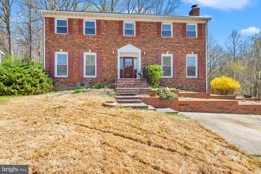 Welcome to Marlboro Meadows.  Come Experience this Spacious Home with 4 Bedrooms, 2 Full Baths and 2 Half Baths.  Main Level Offers Kitchen with Island, Granite, Double Sink, Family Room, Living Room, Dining Room, and Wood Floors.  Sunroom off of Kitchen.  Walkout Basement  Partially Finished with Brick Fireplace, Bar Area, Second Sunroom, Work Area Room, Room for Storage or Other Activity, and Utility Room with Washer and Dryer.  Outdoors with Fenced Backyard, Deck, and Storage Shed.  Must See to Appreciate.  This Home does have Solar Panels that will Remain.