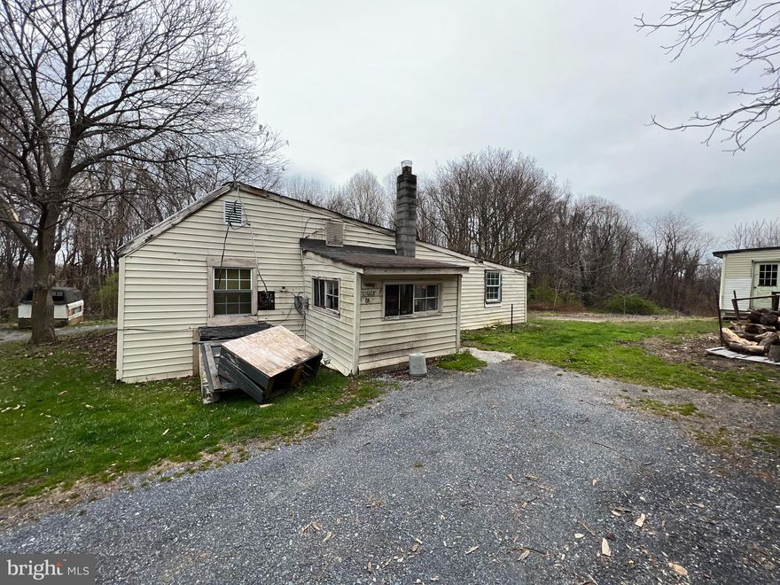 There are buildings on this lot however the value is in the land only.  Buildings are not safe to enter. House shall be viewed only from the outside. Buyer to verify all county notices and disclosures.  Sellers make no warranties or representations.  Sellers are selling the property as is. Buyer to do their due diligence with county or governing jurisdiction to verify what is required should they wish to keep the buildings or wish to tear down and rebuild.