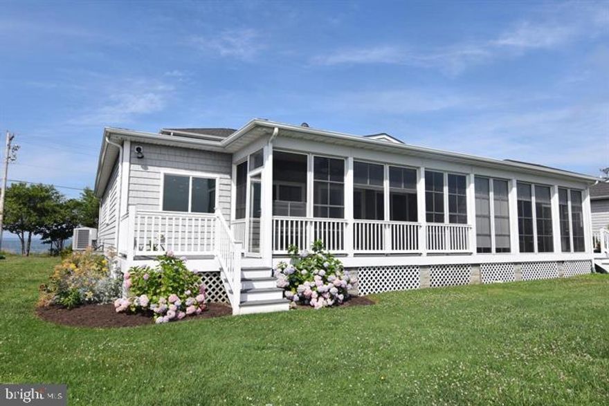 Waterfront duplex on St George Creek!! Panoramic sunrise views. Many upgrades in 2021 include luxury vinyl plank throughout main level, high end carpeting on stairs and second level, fresh paint, ceiling fans installed in all bedrooms and 2 on covered porch, garage shelving added for ample storage, and fresh landscaping! Primary suite on main level with primary bathroom featuring double sinks, soaking tub, and separate walk-in shower. Open floor plan, high ceilings, screened porch, deck, 2 car garage. Deeded boat slip # 3. Close proximity to restaurants by boat or car!!! Public boat ramp, Piney point light house museum & beach close by. HOA fees include lawn maintenance & pier maintenance.