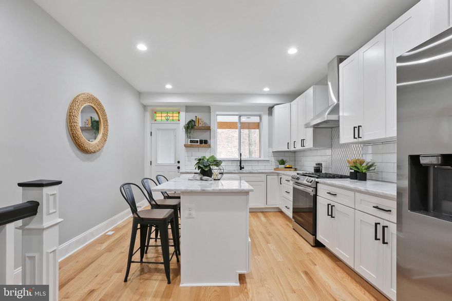 BRAND NEW 13.5+ FT WIDE CHAP RENOVATION WITH OFF-STREET PARKING PAD. LOW TAXES. GLISTENING HARDWOODS CASCADE THROUGHOUT. ENJOY CUSTOM CABINETRY, UPGRADED TRIM AND PAINT PACKAGE, IMPORTED TILE, QUARTZ COUNTERTOPS, HIGH END SS APPLIANCE PACKAGE IN DESIGNER CHEF'S KITCHEN. TONS OF NATURAL LIGHT. FINISHED LOWER LEVEL WITH BASEMENT EGRESS. HIGH CEILINGS. TONS OF STORAGE. EXPOSED BRICK. WALK-IN SHOWERS. WALK-IN CLOSETS. SPACIOUS 4 BEDROOMS WITH 3 BATHROOMS. CUSTOM BUILT-INS. EXPANSIVE ROOF DECK FOR ENTERTAINING. CLOSE PROXIMITY TO RETAIL SHOPPING, LOCAL DINING, PATTERSON PARK, AND ALL MAJOR HIGHWAYS. SCHEDULE A PRIVATE TOUR TODAY!