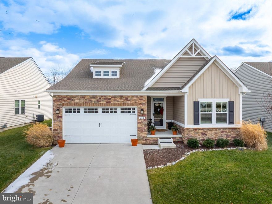 Welcome to 230 Anglesey Drive, a stunning home where luxury and thoughtful design meet everyday comfort. Step inside and be greeted by soaring 9-foot ceilings and rich 6-inch hardwood planks that flow throughout the main living areas, setting the tone for the elegance that awaits within. The open-concept floor plan creates a seamless transition between living, dining, and entertaining spaces, anchored by a warm gas fireplace and framed with timeless plantation shutters.
At the heart of the home lies a chef-inspired kitchen, beautifully appointed with porcelain backsplash, quartzite countertops, and a striking 8.5-foot island perfect for gathering. GE stainless steel gas appliances – including an electric wall oven, built-in microwave, and full gas stove – ensure that both cooking and hosting are effortless. 
This home offers two spacious bedrooms along with a sophisticated office featuring designer grass cloth wallpaper, easily transformable into a third bedroom if desired. The primary suite is a true retreat with a dramatic trey ceiling and a spa-like bath showcasing a floating vanity, walk-in porcelain shower with mother-of-pearl accents, brushed gold fixtures, complemented by an anti-steam mirror with a mini heater above the shower. A custom-built linen closet adds both convenience and luxury. Two additional full bathrooms provide convenience and style for guests and family alike. A laundry room off the primary bedroom includes a Maytag washer and dryer (gas).
The living space extends into the finished, wide-open basement, offering incredible flexibility with its own full bath and endless possibilities for recreation, hobbies, or guest accommodations. Storage is thoughtfully integrated throughout the home, complemented by modern recessed LED lighting and a tankless Noritz water heater that ensures energy efficiency and endless comfort.
Outside, a fenced-in backyard invites relaxation and entertaining with a covered, composite deck – your private outdoor oasis. An attached two-car garage completes this exceptional home and adds everyday practicality.
Located in the 55+ section of the Preserve at Deep Creek known as Legacy, homeowners enjoy exclusive access to the 55+ pool, clubhouse, and fitness center, plus full use of community-wide amenities. While only two streets are age-restricted, all residents in Legacy enjoy shared benefits, with added exclusivity reserved for 55+ homeowners.
Commuting and convenience are effortless thanks to the home’s central location – with quick access to I-95, Route 1, Delaware and New Jersey beaches, shopping, dining, and the bonus of tax-free retail in Delaware.
With its blend of luxury finishes, modern comforts, and flexible living spaces, 230 Anglesey Drive offers the perfect home for your next chapter.