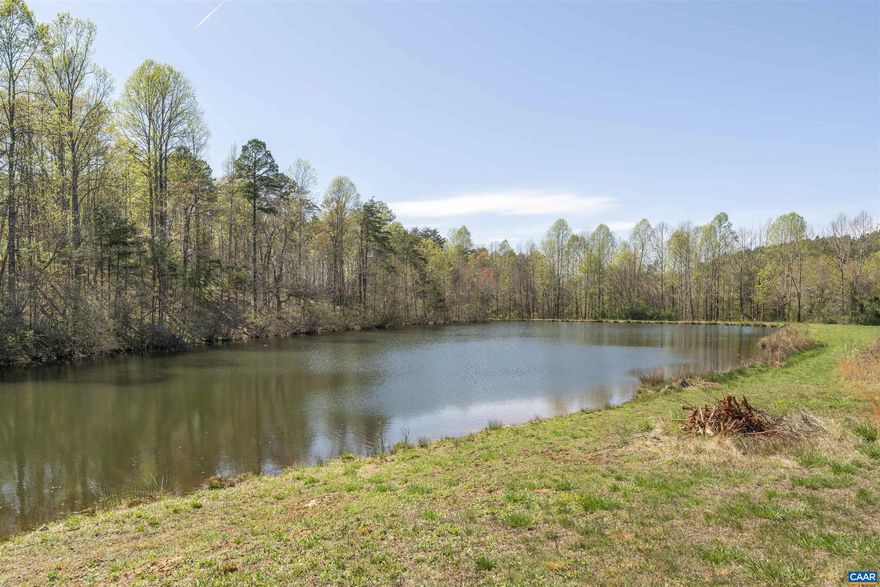 New price! Architect-designed waterfront retreat!  This light-filled home offers a rare blend of modern lines and natural serenity.   Set on 2 acres with lake frontage and mountain views, it's an ideal escape - just close enough to DC or Charlottesville for weekend retreats or inspired remote workdays.  Inside, vaulted ceilings, many windows, and a clean, MCM layout create a sense of calm and clarity.  2br, 1 full bath, and an oversized 2 car garage with electricity for studio or storage needs.  Impeccably maintained and quietly tucked into a grassy, low-key subdivision.  A hidden gem for creatives, second-home seekers, or anyone craving light, land, and water.,Formica Counter,Wood Cabinets