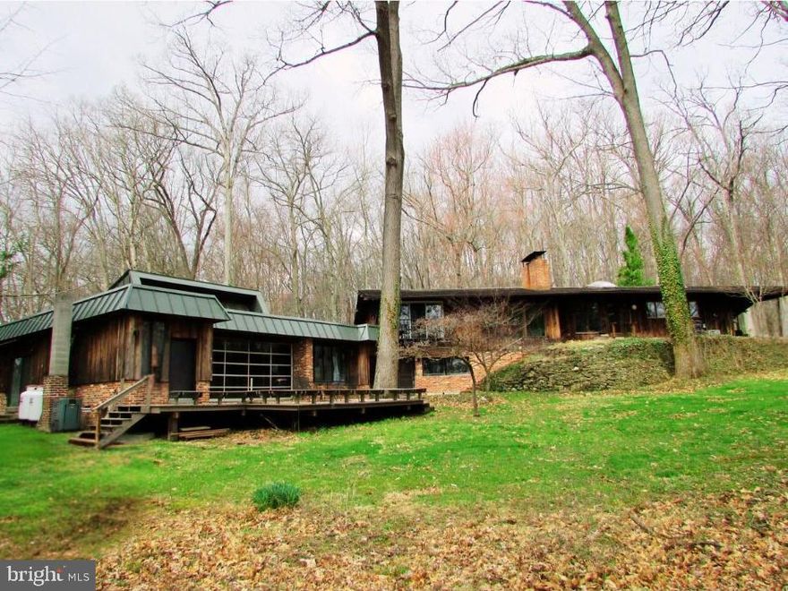 Nestled in the vibrant city of State College, is THE hidden gem you have been looking for. This property is located on Tall Oaks Drive which describes the property perfectly! The epidemy of seclusion with tall trees surrounding most of the property. You will feel like you're out in the country, but in reality, this property is located just 2.9 miles from Penn State University. If the location wasn't enough to pique your interest, how about an indoor pool? What a commanding presence this sprawling 3,958 sq ft brick ranch house has! When you enter the home, the slate foyer is impressive. All the bedrooms have beautiful hardwood flooring, and lots of windows for a flood of natural light. The large eat-in kitchen will delight any chef. The kitchen includes a lovely skylight, exposed beams, and rustic brick fireplace perfect for setting up the ambiance. The walkout lower level is finished for entertaining. You can pull up a seat at the bar, there is a perfect spot for a pool table, an invigorating sauna, convenient full bathroom, handy tool room, and this lower-level leads into the enchanting indoor pool house. The pool house has a great feature of a large garage door that opens to seamlessly blend indoor and outdoor living. The spots to entertain don't stop there as there is a 32' x 20' lower deck (with build in benches) ideal for gatherings, and a patio right off the kitchen perfect for grilling! On the property is a shed, small horse barn, doghouse, and covered area for firewood. Approximately 7 acres of this property are woods to explore, possible pasture, or could be the site of a future home. The possibilities are endless, and who says you can't have it all?!
***CONTACT LISTING AGENT ABOUT THE POSSIBILITY OF SELLING TWO PARCELS. THE HOUSE WITH APPROXIMATELY 4 ACRES AND A WOODED LOT OF APPROXIMATELY 7 ACRES.***