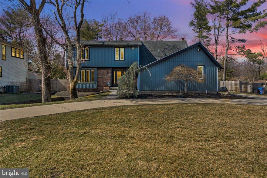 Look no further—your dream home is right here! This stunning 4-bedroom, 2 full-bath, and 2 half-bath home is nestled in the highly desirable Woodcrest community of Cherry Hill on a low-traffic cul-de-sac that leads directly to Bunker Hill and Magic Forest hiking trails. With numerous updates throughout, this home is truly move-in ready. Step into the spacious entry foyer, complete with a large coat closet. The living room is bathed in natural sunlight, while the dining room provides ample space for hosting gatherings. The updated eat-in kitchen boasts granite countertops, newer cabinets with a built-in wine storage area, a desk space, and a large pantry. A new sliding glass door off the kitchen leads to the backyard. Adjacent to the kitchen is the inviting family room, featuring a wood-burning  floor to ceiling brick fireplace. Also on the main level, you’ll find a home office, a powder room, and a convenient laundry room equipped with a laundry tub and laundry chute. Upstairs, the primary suite is a true retreat, offering a separate sitting area with two large closets, a walk-in closet in the main sleeping area, and a beautifully updated ensuite bath. The three additional bedrooms are spacious, filled with natural light, and provide generous closet space. The second full bath has been updated with a new vanity and toilet. Finished Basement provides additional living space and includes a half bath while still offering plenty of storage options. This home has been meticulously maintained and recently updated throughout, including: Brand new windows, gutters, siding, roof and electric as well as Beautiful LVP wood floors and new carpet in the basement and on the staircase. The beautifully landscaped fenced in backyard offers ample space for relaxation and outdoor activities. The circular driveway provides plenty of parking. The home is just a short walk to Woodcrest Swim Club, Woodcrest Elementary School, and Rosa Middle School. Additionally, it offers easy access to Highway 295, the high-speed line, and is just a quick drive to Philadelphia and the Jersey Shore. This home truly has it all—modern updates, prime location, and a fantastic community. Don’t miss your chance to make it yours!