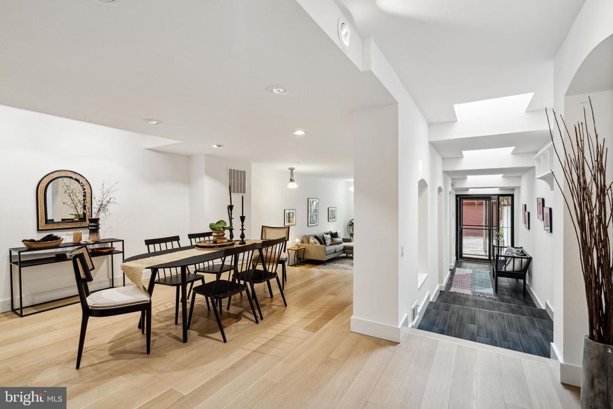 A remarkable architectural delight with plenty of sunlight radiating from its center staircase light well and a dramatic hall lined with skylights. This  20' wide home has an open Foyer, a spacious first floor with wide plank oak floor, a wall of custom niches, a separate dining area, and a step down large living room. The cook's kitchen is filled with cabinets and features black absolute granite tops, a Fisher Paykel 2 drawer dishwasher, a 5-burner stove with dual/convection oven, range master hood, wine cooler, tile backsplash, built-in microwave, LG Smart French door (WIFI) refrigerator plus two pantries. The second floor has 4 bedrooms, a hall bath/laundry room with an LG side by side washer/dryer with steam. The third floor has  tons of windows and light. The  master bedroom suite features a large balcony, a sumptuous bath with a Kohler soaking/whirlpool tub, Grohe fixtures, heated towel rack, double vanity with granite top and Kohler sinks, frameless shower doors, glass tile. There is also a vast well organized custom walk-in closet  and a small office with a built-in L desk. The lower level has a guest bedroom, a full bath with an Italian shower and a  den/playroom with built-in bookcases plus a 6' safe. Other amenities include, 3 new Porcelanosa baths with radiant heat floors, 2 water heaters, 2 HVAC systems, Video doorbell and thermostats are phone controlled, Elfa decor closets throughout, Pella windows, and a huge amount of storage. This fantastic home also has an EP Henry brick paved garden and 2 Car Parking!  Located on a quintessential Queen Village block, the property  location is a short walk to Meredith school  This architectural gem is walking distance to many cafes, restaurants and boutiques, parks and playgrounds. With its prime location and timeless beauty, 732 East Passyunk  is a rare gem that will not last long on the market. Schedule your visit today and make this stunning home yours.