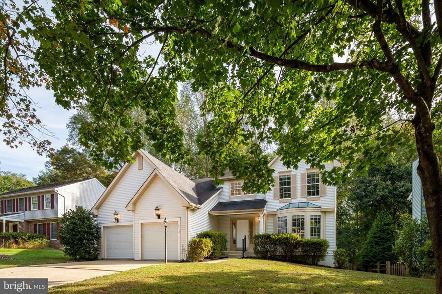 Welcome to 6111 Dry Leaf Path!!! Tucked away on a quiet cul-de-sac in the highly sought-after Hickory Ridge community, this beautifully appointed 4-bedroom, 3.5-bath Colonial offers a rare blend of timeless elegance and modern comfort, all set against a serene wooded backdrop. A grand two-story foyer welcomes you into a light-filled interior defined by rich hardwood floors, classic architectural details, and a thoughtfully designed traditional layout. Formal living and dining rooms with striking bay windows provide the perfect setting for refined entertaining. At the heart of the home, the eat-in kitchen features granite countertops, stainless steel appliances, double wall ovens, a cooktop, and a spacious center island with bar seating—seamlessly connecting to the inviting step-down family room. Here, custom built-ins, a wood-burning fireplace, and picturesque wooded views create a warm yet sophisticated gathering space. Upstairs, the expansive primary suite serves as a private retreat, highlighted by soaring cathedral ceilings, a generous walk-in closet, and a spa-inspired ensuite bath with soaking tub, dual vanities, and a separate shower. Three additional well-proportioned bedrooms and a full bath complete the upper level. The walk-out lower level is designed for both relaxation and entertaining, featuring a spacious recreation room equipped with a dual-zoned A/V system, surround sound, and subwoofer, along with a wet bar, full bath, and a versatile bonus room ideal for a home office, guest suite, or optional fifth bedroom. Outdoor living is equally impressive, with a premium Trex deck with two separate landing areas overlooking tranquil wooded surroundings and offering direct access to nearby scenic walking trails—perfect for enjoying nature in privacy. Extensive recent upgrades include a high-efficiency Carrier HVAC system (2021), new Trex deck (2021), insulated and finished garage (2021), 80-gallon water heater (2024), and new kitchen windows and microwave (2026), ensuring both style and peace of mind. Location is everything, and you'll appreciate the proximity to walking paths, playgrounds, shopping, dining, theaters, entertainment options, and more. The yearly HOA Fee (CPRA- Columbia Association) offers many amenities, including nearby walking paths, playgrounds, and discounted memberships to gyms, pools, and golf courses. Commuting is easy with close proximity to Rt.. 29, Rt. 32, and I-95, and you’re only 25 minutes to BWI Airport, MARC stations, Fort Meade, and NSA. Don’t miss this incredible opportunity to enjoy comfort, convenience, and vibrant community living—schedule your showing today!