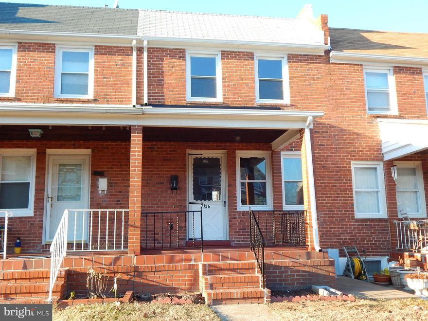 Immaculate porch front townhome with new kitchen, new SS appliances, new w/w carpet in living room and lower level family room, washer and dryer included, freshly painted throughout, recently installed gas heat and central air as well as new windows and front entry door. Fenced rear yard, spacious basement utility room / laundry room and updated outlets, switches and  house power.
