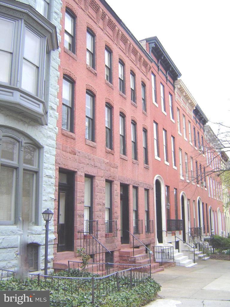 Convenience and Beauty all in one! The largest unit in the building now available. This ground floor unit has a secure and private separate entrance. Very bright and spacious, with storage galore. There's an exposed brick decorative fireplace and floor to ceiling windows that let in lots of natural light. The open floor plan, vinyl plank and carpeted floors, central air and heat, stainless steel appliances, and washer/dryer add to the many amenities in this unit. Private rear entrance leads to your off street parking space. All of this and in a pet friendly building! Close to MICA, U of Baltimore, light rail, metro, downtown, and more.