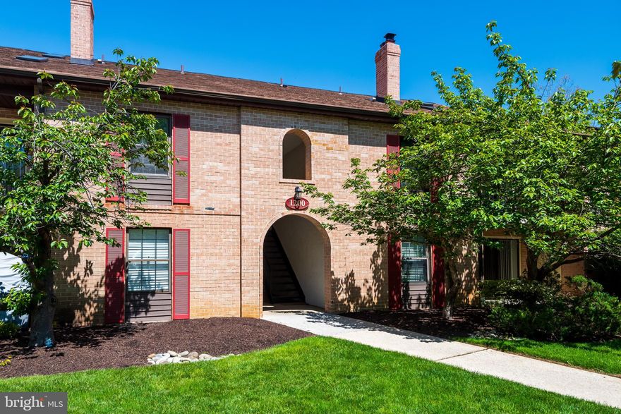 Welcome to 1210 Eagles Ridge, a wonderful first-floor home with hardwood flooring and new carpet in the desirable Eagles Ridge neighborhood of Chesterbrook. This is a terrific opportunity to own a very well-maintained home in the top-ranked Tredyffrin-Easttown School District. This special residence offers a private entrance and a coveted split-bedroom floor plan. A tiled entrance foyer welcomes you into a true one-level living home. The centrally located kitchen features hardwood flooring, abundant cabinetry, updated stainless steel appliances, and generous counter space. The open living and dining areas offer beautiful hardwood floors, a nicely painted fireplace with a handsome (and very heavy!) magnetic cover, and sliding glass doors leading to a spacious patio—perfect for outdoor dining or relaxing. The primary bedroom features hardwood flooring, a large walk-in closet, a ceiling fan, and a private bathroom with tile flooring and an updated vanity. A second bedroom with new carpet and a full hall bathroom—with tile flooring, an updated vanity, and a newly refinished tub/shower—completes the layout. The bedrooms are positioned on opposite sides of the living space, offering excellent privacy. Additional features include a washer and dryer conveniently located off the second bedroom, generous storage space, and true no-step first-floor living. Ideally situated near Chesterbrook trails, Wilson Farm Park, Valley Forge National Historical Park, and the trains, shops, and restaurants of The Main Line and King of Prussia Town Center, this immaculate home offers comfort, convenience, and an exceptional location. Enjoy first-floor living at its best. Welcome home!