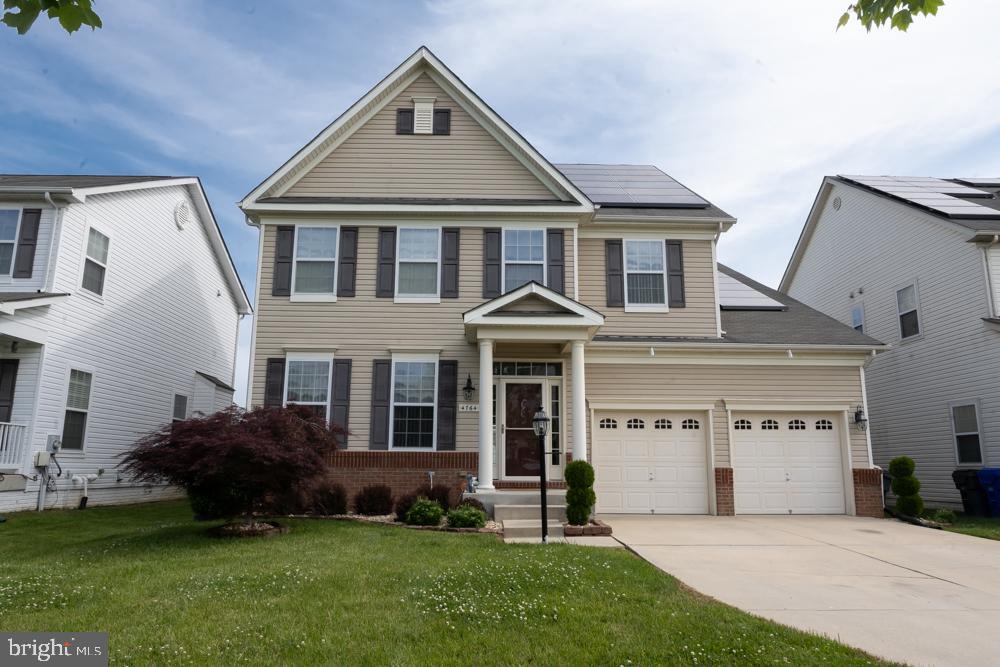 Excellent Condition! This gorgeous and spacious home features 4 bedrooms, 2 full bathrooms, and 2 half bathrooms. The kitchen is updated with granite counters and stainless steel appliances. The laundry room with a washer and dryer hookup is conveniently located on the home's top level. The downstairs finished basement offers a great place to gather with a wet/dry bar and lots of open space. This home also features dual hvac controls on the main and top levels, offering maximum comfort for everyone. With so many features in this home, of course it has solar panels also! On average, the previous owners paid $10 a month for electricity from solar savings!