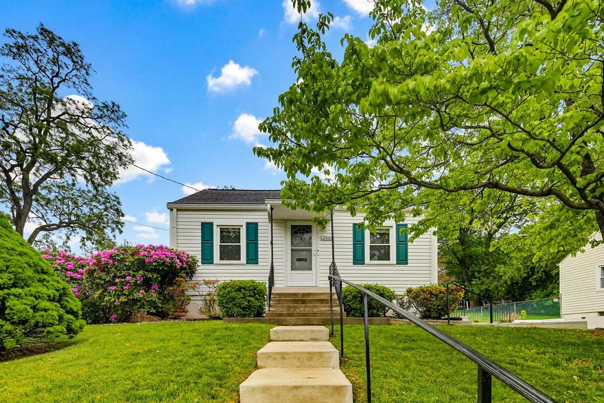 Charming classic cottage in sought-after Veirs Mill Village! This beautifully maintained and updated 3-bedroom, 2 full bath home has been lovingly cared for by its longtime owner and is truly move-in ready.  Inside, you’ll find a bright and inviting layout featuring a spacious eat-in kitchen with gas cooking, bright living room, and generously-sized bedrooms including a primary bedroom with attached bath. Updates include a newer roof (2013), windows (2010), driveway for off-street parking, driveway retaining wall (2022), attic insulation (2021), front steps (2024) and the added peace of mind of a whole-house generator. Finished lower level with separate office, utility/storage room, and large den area for relaxing, gaming, a playroom, and more. Step outside to enjoy the spacious patio—perfect for relaxing or entertaining—complete with a retractable awning for shade and comfort. Ideally located just one block from the Rock Creek Park Trail and minutes from major commuter routes, shopping, dining, and everyday conveniences, this home offers both charm and accessibility. Don’t miss this wonderful opportunity!