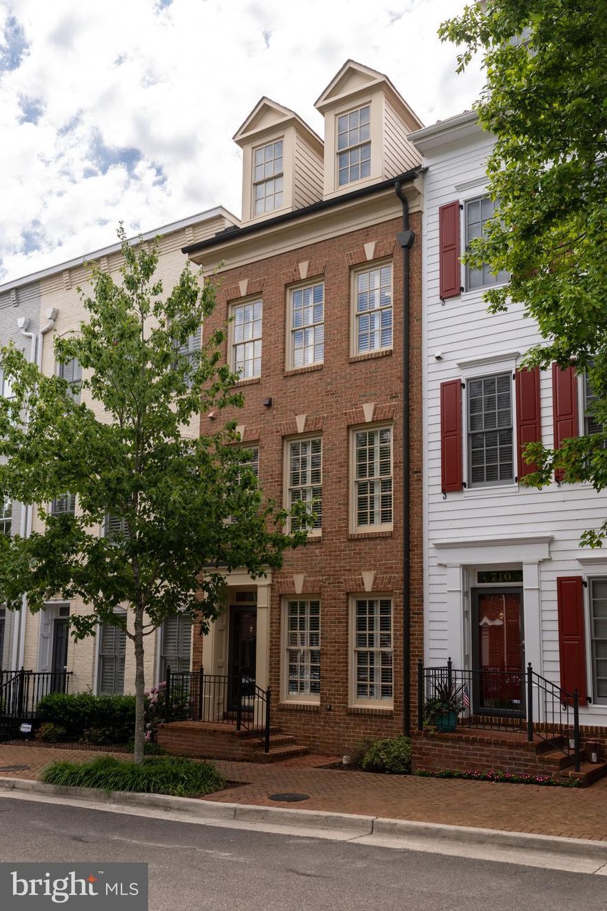 Fabulous updated three-bedroom with three and a half baths townhome in sought after community of Potomac Greens located on a beautifully maintained tree-lined street.  This property features many modern updates throughout the property from oversized tile in foyer, flush mount for iPad & docking station, display cabinets in the two-toned gourmet kitchen with granite countertop & stainless steel appliances, gorgeous wide plank maple hardwood floors throughout, in-wall audio/video prewiring above the fireplace with an access panel,  updated lighting throughout, nest thermostat, en-suite master bath with separate soaking tub & Riverstone shower with tile detailing & Dulles glass, oversized tile flooring laid on diagonal heated floors all in the master bath which was remodelled in 2018.  Property has a grill deck off the kitchen and a rooftop terrace with additional storage off the third bedroom.  All bedrooms have en-suite baths and wide plank maple hardwood floors.  Community Features:  Clubhouse with Exercise Room, Meeting/Party Room, Outdoor Heated Pool, Tot Lots & Pocket Parks, Nature Trails, Community Shuttle & Short Distance to Restaurants & Shops, Near our Nation's Capital, Reagan National Airport & Amazon & Virginia Tech Innovation Campus. This is a must-see property with extremely well-done updates.