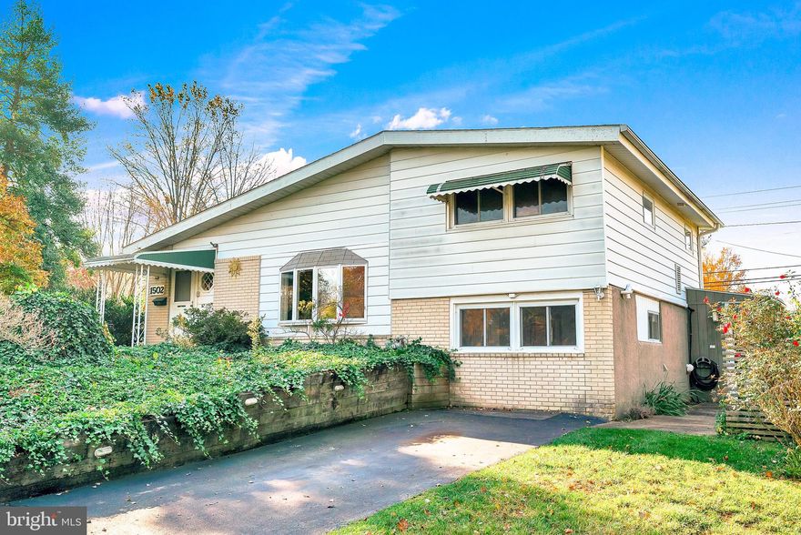 Step back in time with all the charm of yesteryear at 1502 Muhlenburg Dr. This 3-bedroom, 1.5-bathroom home may be cosmetically dated, but it has been impeccably maintained, and is ready for you to add your own modern touch. Boasting Wissahickon schools and an extremely friendly neighborhood, 1502 presents a fantastic opportunity. Imagine the possibilities as you enter the spacious living room, a vaulted ceiling and large bay window add character to this classic space, and hardwood flooring can be found beneath the carpet. It’s the perfect time of year to appreciate the gas stove which exudes warmth and comfort; perfect for those cozy movie nights or intimate gatherings. The open layout seamlessly connects the living room to the dining area, with views into the sunroom and kitchen. The dining room also boasts a bay window and hardwood flooring under the carpet. The galley style kitchen offers a large triple window over the sink with an ideal shelf for an indoor herb garden. The kitchen also offers gas cooking, a dishwasher, ample cabinetry, and a pantry.  One of the home's unique features is the sunroom, located off the dining room. Surrounded by three walls of windows and a slider that leads to the rear yard, this space is a tranquil oasis that truly brings the outdoors in. The wood-burning stove offers comfort and warmth in the cooler months and the ceiling fan provides a nice breeze in the summer, making this room perfect for all seasons. Down below, off the living room, you will find a cozy family room, as well as, a laundry room, mudroom, powder room, bonus room (where you access the central vac system), great storage space, and outside access to the side yard. Upstairs, you will find three bedrooms (all with ceiling fans), a hall bathroom, and linen closet.  Outside, you will love the 1/3-acre corner lot, adorned with mature trees and landscaping. This inviting outdoor space allows you to unleash your landscaping creativity or simply enjoy the serenity that already exists. Just a short stroll away, you have the pleasure of exploring Center Square Park and Erb's Mill Park. The property's prime location ensures that you're close to Blue Bell's restaurants and shopping, making it convenient to enjoy the local amenities. When you need to hit the road, easy access to major highways like 202, the Blue Route, and turnpike simplifies your daily commute. You'll have more time to cherish your newfound home. This home has been lovingly cared for and has only had two owners, a testament to its enduring appeal and value. If you're a savvy buyer with a vision for transformation and a desire for a well-maintained home with timeless charm, then this Blue Bell home could be your ideal match. Don't let this opportunity pass you by. Schedule a tour today to explore the endless possibilities that 1502 Muhlenburg Dr offers.