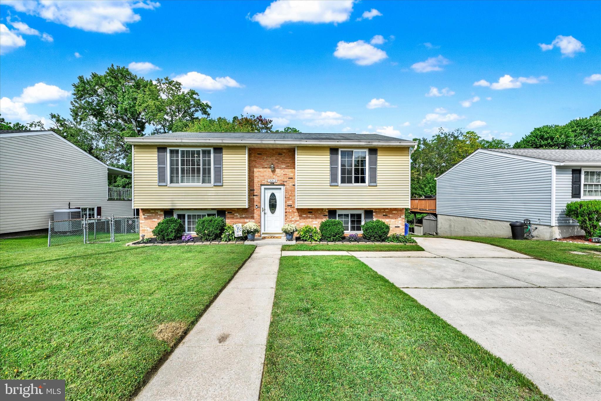 Welcome to 2212 Monocacy, a charming split foyer with tranquil water views of Middle River. Offering nearly 1,800 square feet of finished living space, this home blends open design, stylish updates, and outdoor living. The main level has been reimagined with an open floor plan that connects the kitchen, dining, and living areas. A bright bay window fills the living room with natural light, while the remodeled kitchen features a large island with seating and extra storage. Luxury vinyl plank flooring flows through the living and dining rooms and continues down the hallway to two bedrooms and a full bath, completing the main7 level. The finished lower level adds more than 850 square feet, including a spacious rec room with a wet bar, an additional bedroom, half bath, and a large laundry room. Sliders from the rec room open to a patio, while sliders off the dining room lead to a covered deck overlooking Middle River. A second, oversized 24’ x 24’ deck below creates multiple spaces to relax or entertain with a view. Other highlights include HVAC replaced in 2021, a fully fenced yard with two garden beds, and a generous driveway with plenty of parking. Nestled on a quiet street with no HOA, this home offers comfort and privacy, in a serene and natural setting.
