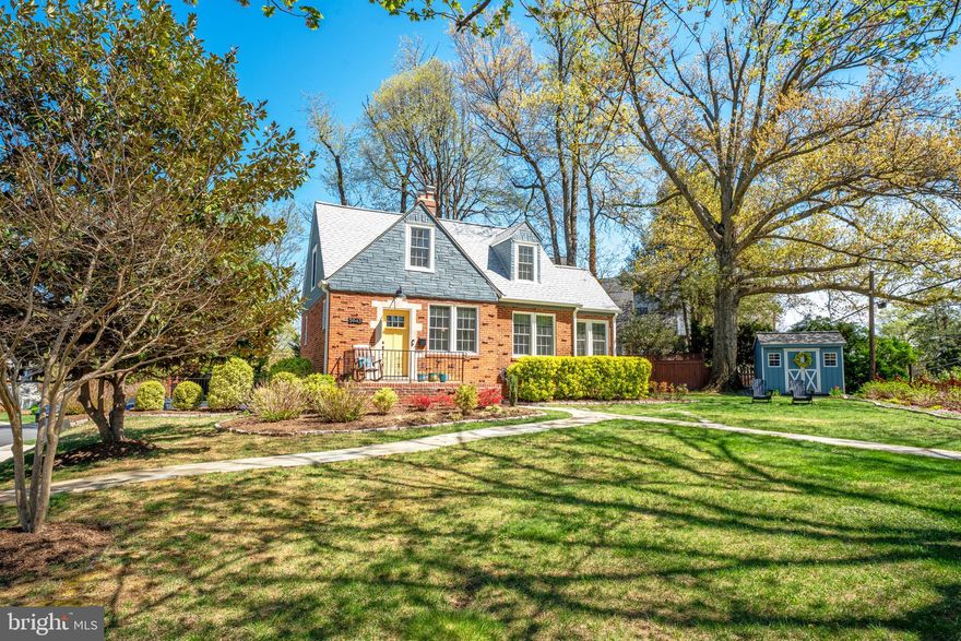 A Cape to Covet !!  It's the one with the Yellow Door!  It's the one you've always admired as you pass by! Striking, Captivating  and with a Storybook kind of quality.  What you will really find astounding is the light that pours in through large Pella windows. This property draws you in from your first step onto the  Pennsylvania Flagstone walk, onto the front porch with room for a rocker and into the house through the stunning yellow front door.  Nothing but quality updates inside and out.  The huge quartz island in the  breathtaking heart of the house kitchen, made possible thanks to a thoughtful bump out in the back, will become your happy gathering spot.  Don't miss the beautiful blue cabinetry there and at the dry bar with full height brick accent wall.  After plenty of time in the culinary wonderland with KitchenAid appliances, sit by the fire in the living room or enjoy special light in the sunroom...also perfect for a home office. When you are ready for some time outside pass through the mud room and head to the Virginia Flagstone patio out back. Professional landscaping and new fencing enhance this outdoor oasis.  Gleaming hardwood floors and staircases take you up or down.  The upper level primary bedroom is an escape under the eaves grounded by hardwood floors and lit by windows on three sides. The  window seat in the dormer window, with custom upholstered cushion, invites a special pause.  Two secondary bedrooms also feature hardwood floors and generous closet space.  The impeccable oversized full bath, with marble-topped vanity and glass tile in the tub/shower, is a spa experience waiting to happen.  When it's time to hang out in casual comfort, the lower level family room is the place to be.  A large window lights the space and a convenient door gives access to the expansive concrete driveway with room for two cars.