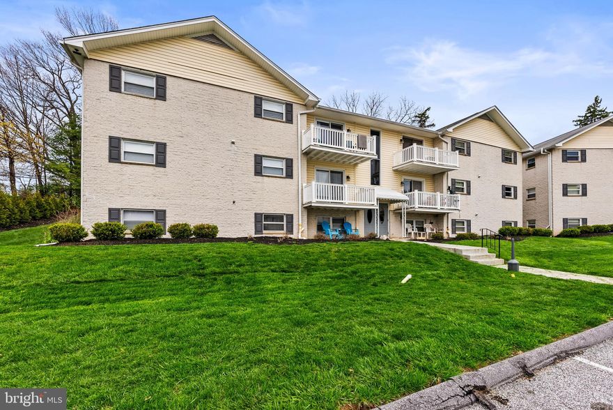 Rarely available 3 bedroom, 2 bath garden-style condominium in the heart of Cockeysville offers the perfect blend of updates, comfort, and modern appeal, all nestled within the sought-after Warren Lodge community.
Step into a spacious, freshly painted and renovated interior boasting 1,215 square feet of bright, open living space. The main living area features, crown molding, wood burning fireplace, and exposed ceiling beams that add warmth and character,  creating an inviting atmosphere for relaxing or entertaining.
The kitchen has been fully remodeled with granite countertops, updated cabinetry, and stainless steel appliances, including a built-in microwave and dishwasher. A convenient brand new in-unit laundry station adds modern ease. There are 3 generously sized bedrooms with plush brand new carpet, and the primary bedroom includes a walk-in closet, full bath, and bright finishes. There is a second full bath in the main hallway which is also updated, bright and roomy. The building is secure, and has ample parking, beautifully maintained landscaping, and a community pool. One of the largest unit in the community, offering plenty of space, updates and low-maintenance, on a peaceful private street, while still conveniently located near shopping, dining, commuter routes, and parks.