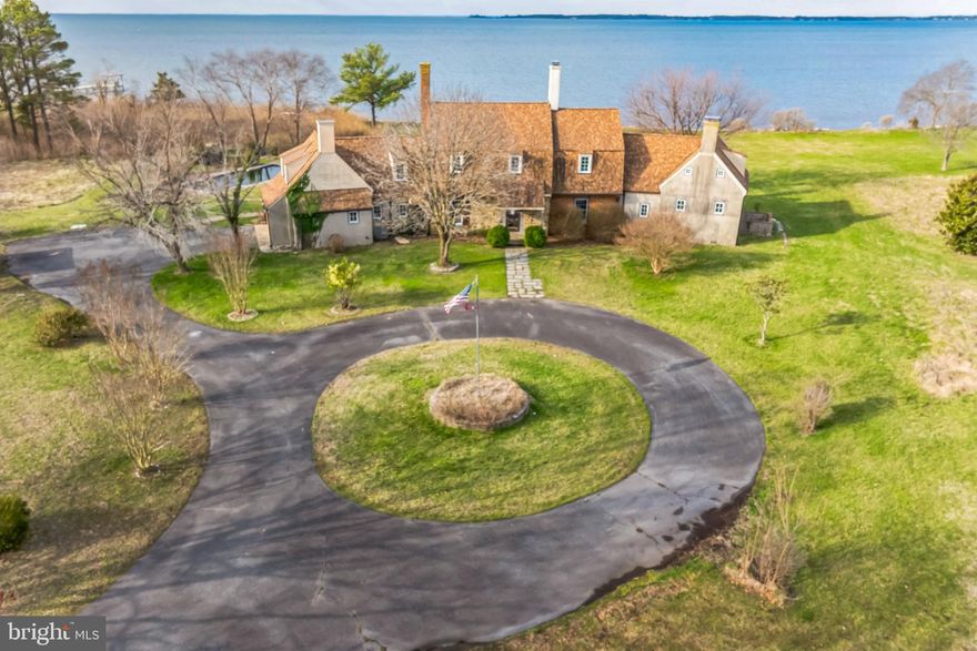 Exquisite Waterfront Estate in Neavitt, Maryland just minutes from historic St. Michaels.
Welcome to a rare opportunity to own a truly exceptional waterfront estate in the heart of Maryland’s Eastern Shore. Nestled on over 14 pristine acres, this magnificent property boasts 7 spacious bedrooms, 5 full bathrooms, and 2 powder rooms, offering luxurious comfort for both everyday living and grand-scale entertaining.
Custom-built to embrace the natural beauty of its surroundings, the home is perfectly positioned along a serene stretch of the Choptank River with expansive water views from nearly every room toward the Chesapeake Bay. Enjoy over 600 plus feet of private shoreline, complete with a dock ideal for boating, crabbing, or simply watching the sunset.
The residence features over 4,000 square feet of elegant living space, highlighted by high ceilings, oversized windows, and an open-concept layout that seamlessly blends classic Eastern Shore charm with modern sophistication. The main level includes a gourmet kitchen, multiple entertaining areas, and a generously sized primary suite with spa-like bath and private terrace.
Enjoy an inground pool, multiple gathering patios, and vast lawns that invite relaxation or recreation. Whether you're seeking a private retreat, a family compound, or a waterfront lifestyle, this remarkable estate checks every box.
To help visualize this home’s floorplan and to highlight its potential, virtual furnishings may have been added to photos found in this listing.