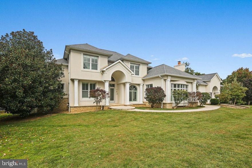 A rare opportunity to experience refined living in one of the most serene settings, this beautifully crafted home blends architectural drama with thoughtful design and exceptional comfort. The moment you enter, soaring cathedral ceilings and striking Italian marble flooring create an immediate sense of luxury, drawing natural light across the home’s elegant living spaces. Every room has been designed with both beauty and functionality in mind—from the formal dining room ideal for memorable dinners and celebrations, to the inviting main living areas that transition effortlessly between relaxed everyday living and sophisticated entertaining. The kitchen is truly the heart of the home—expansive, open, and filled with natural light from endless windows. A large central island anchors the space, offering exceptional room for cooking, gathering, and hosting. Its seamless connection to the surrounding living spaces makes it perfect for both intimate evenings and large gatherings. The main-level primary suite provides outstanding convenience and comfort, ideal for those seeking true ground-floor living. With additional private spaces available throughout the home, the layout easily accommodates multi-generational living or extended-stay guests. The expansive basement further enhances the home’s versatility, featuring a dedicated home theater room and an additional full kitchen—perfect for movie nights, added living quarters, or extended entertainment space. Additional flexible areas offer endless possibilities for recreation, a studio, or customized use. Outdoor living transforms this residence into a personal retreat. A private in-ground pool anchors the backyard, offering a serene place to unwind, enjoy warm weather, or entertain outdoors. The generous lot enhances privacy and tranquility, creating an atmosphere that feels worlds away yet remains close to everyday conveniences. Blending timeless appeal with exceptional livability, this home delivers elegance, comfort, and remarkable flexibility—a rare chance to enjoy a lifestyle defined by both luxury and ease.