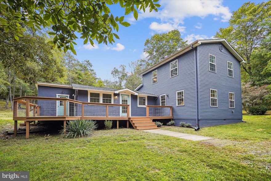 PEACEFUL AND QUIET LOCATION.  REMODELED-ALL YOU HAVE TO DO IS UNPACK AND ENJOY. THIS HOME OFFERS 3 BEDROOMS AND 2.5 BATHS ON 3 PRIVATE ACRES WITH SHED AND CHICKEN COOP.
PRIMARY BEDROOM SUITE, IS LOCATED ON THE MAIN FLOOR, HAS IT OWNS LAUNDRY, (WASHER & DRYER PICUTRED DO NOT CONVEY).    PRIMARY  BATH  FEATURES  SHOWER WITH MULTIPLE SHOWER HEADS, TUB, GLASS WALL AND GLASS DOOR ENCLOSURES WITH CERAMIC TILE CREATING A WET ROOM.    HIS AND HER CLOSETS IN PRIMARY BEDROOM  HAS ACCESS TO THE  PATIO AND LEADS YOU TO THE SIDE YARD SURROUNDED BY TREES, OFFERING THE OWNER A PRIVATE OASIS. 
TOTALLY REMODELED IN 2022, INCLUDES GOURMET KITCHEN WITH ISLAND AND /BAR/PREP SINK, CORIAN,  SILESTONE, AND BUTCHER BLOCK COUNTER TOPS,  DOUBLE PANTRYS, STAINLESS STEEL APPLIANCES,  RANGE WITH CHIMNEY HOOD,  WALL OVEN, DISHWASHER AND  S/S FRIDGE.  
MOSTLY  NEW DRYWALL, NEW HEATING/AIR- 3 HEATPUMPS= MINI SPLITS,  NEW BBH, NEW HOT WATER TANK, NEW FLOORING AND  FRESH PAINT INSIDE AND OUT.
THE UPPER FLOOR OFFERS 2 BEDROOMS AND FULL BATH WITH LAUNDRY HOOKUP FOR THIS FLOOR.
NEW PLUMBING, INSULATION AND ELECTRICAL IN 2021.
THE ROOF, WELL PUMP AND PRESSURE TANK NEW  IN 2018. COME AND VIEW THIS HOME YOU WILL BE GLAD YOU DID.