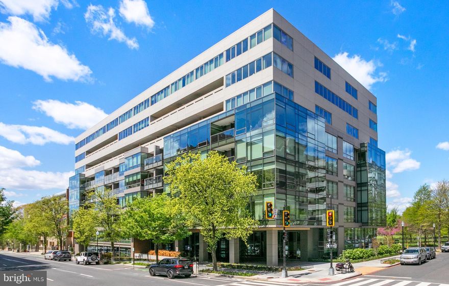NOW OFFERED AT $1,995,000, this terrace-level 2BR/2BA residence at 2501 M Street NW presents a compelling opportunity within one of the West End’s most sought-after full-service buildings.

Positioned just moments from Georgetown, the home reflects a sophisticated, design-forward sensibility, blending contemporary architecture with elevated amenities, including Nobu at street level, and immediate access to premier dining and retail.

The interiors are crisp and intentional, defined by 10-foot ceilings, strong architectural lines, and expansive glazing that fills the home with natural light throughout the day. A welcoming entry leads into a thoughtfully designed layout anchored by a gourmet kitchen with sleek cabinetry, integrated high-end appliances, and an oversized island ideal for gathering.

The adjoining dining area is enhanced by statement lighting and custom storage, creating a seamless setting for entertaining. The living room is exceptionally bright, framed by a full wall of windows, and opens to a private balcony with rare views of Rock Creek Park and Francis Park. A refined library or den is set off by sliding glass door and custom shelving.

The primary suite is privately situated and generously scaled, offering abundant light, a large walk-in closet, and tailored storage. The ensuite bath is finished in marble with a dual vanity, glass-enclosed shower, and separate water closet. A secondary bedroom suite is positioned on the opposite side of the residence, providing comfort and privacy for guests.

Residents of The Westgate enjoy a full complement of amenities, including full-service concierge, a state-of-the-art fitness center with yoga studio, residents’ lounge and library, and beautifully appointed entertaining spaces with a catering kitchen and private dining room. A dedicated garage parking space and substantial private storage convey.