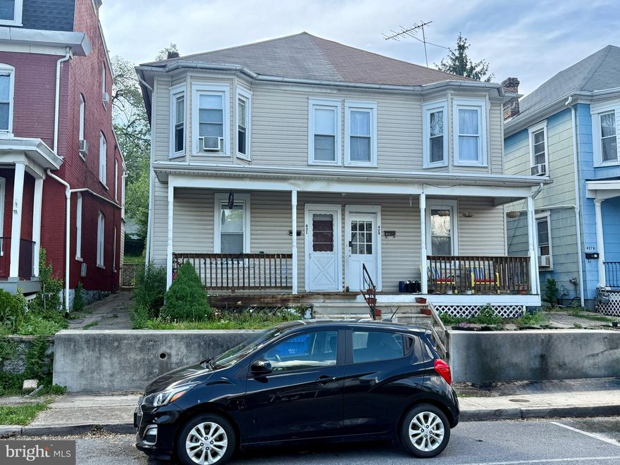 Side by side duplex in great Hagerstown location! Close to City Park, new Meritus Park stadium and the Arts & Entertainment district. Each side features a living room, dining room & kitchen on the main level and 3 BDRM/1 BA on upper level + access to walkup attic. Each side also has a spacious front porch and covered rear patio. 429 has a roof deck that overlooks backyard. Both have fenced backyards. Off st parking in the rear off alley and plenty of street parking out front. EBB heat in 429 & natural gas heating in 431 (429 has natural gas furnace but it's not currently working). GREAT opportunity to add to your rental portfolio or for an owner occupant!
