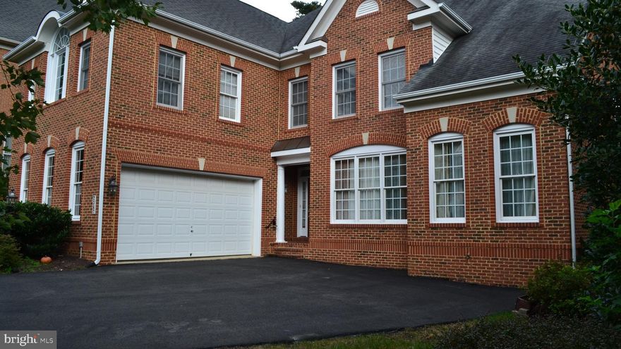 Quality brick beauty on premium lot back to trees with deck and patio. Dramatic and sunny floor plan, loaded with hardwood floors and molding. Upgrade kitchen with cherry cabinet. Stain steel appliance with granite countertop. Main level has Office/Library, Bedroom with full Bathroom. Amazing Master Bedroom with tray ceiling, his and her walk-in closets.  Basement with wet bar, with granite countertop and big game area. Media room/ 6th Bedroom with full Bathroom. Sprinkler system/ central vacuum. Walk to metro. Located between Dunn Loring  and Tysons Corner.