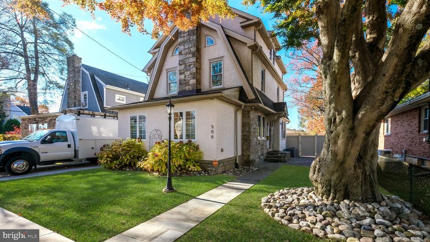 Welcome to 506 Childs Ave — a truly one-of-a-kind custom renovated home in the heart of Drexel Hill. Completely rebuilt from the studs up by the owner, a licensed contractor, this stunning 3-story home blends timeless craftsmanship with modern luxury throughout.

From the moment you arrive, the curb appeal stands out with professionally landscaped grounds, river rock accents, and a beautiful slate walkway leading to the front entrance. Inside, you’ll find pre-finished hardwood flooring, crown moulding, and 8.5-foot ceilings flowing throughout the 1st and 2nd floors. The inviting living room centers around a gorgeous stone wood-burning fireplace, with an enclosed front porch on one side and an open flow into the dining room on the other.

The expanded open-concept kitchen was designed for both everyday living and entertaining, featuring abundant cabinetry and countertop space, granite countertops, stainless steel appliances, a large center island with seating, wet bar sink, built-in wine storage, and direct access to the rear deck and powder room.

The 2nd floor offers three generously sized bedrooms and a beautifully finished hall bath with travertine tile and floor-to-ceiling tub surround. Occupying the entire 3rd floor, the private primary suite feels like a luxury retreat with a walk-in closet and spa-inspired bathroom featuring a dual vanity, oversized tiled shower, corner jetted tub, and dedicated linen storage.

Outside, the professionally hardscaped rear and side yards create your own private oasis with extensive paver patios, a meticulously maintained hot tub, 6-foot privacy fencing, and access to the oversized commercial-grade 3-car garage.

Additional upgrades include dual-zone HVAC, 200-amp electrical service with additional 50-amp garage service, hardwired speakers, hardwired smoke detectors, replaced cast iron stack, newer PVC sewer line to the street, and a dry unfinished basement with laundry hookups and excellent storage.

This is more than just a home — it’s a rare opportunity to own a meticulously renovated property where every detail was thoughtfully completed. In the seller’s own words: “I am going to miss this place.”