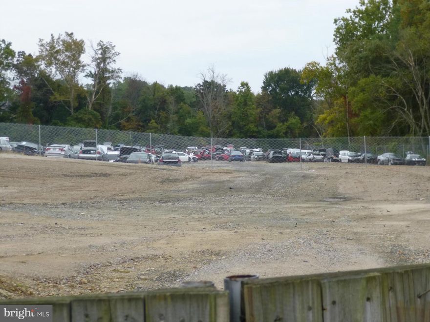 AFFORDABLE OUTSIDE STORAGE LOT, FULLY FENCED, WITH A MOSTLY GRAVEL BASE.  DOUBLE ENTRANCE GATE USES YOUR PRIVATE LOCK FOR 24 HOUR ACCESS!  ZONING ALLOWS FOR NEW OR USED VEHICLE STORAGE AND MANY OTHER USES. APPROXIMATELY 30,000 SQUARE FOOT LOT MEASURING 200 FT. X 150 FT. SUPER EASY ACCESS ON ROUTE 1 JUST NORTH OF DALE BLVD AND SOUTH OF OPITZ BLVD.